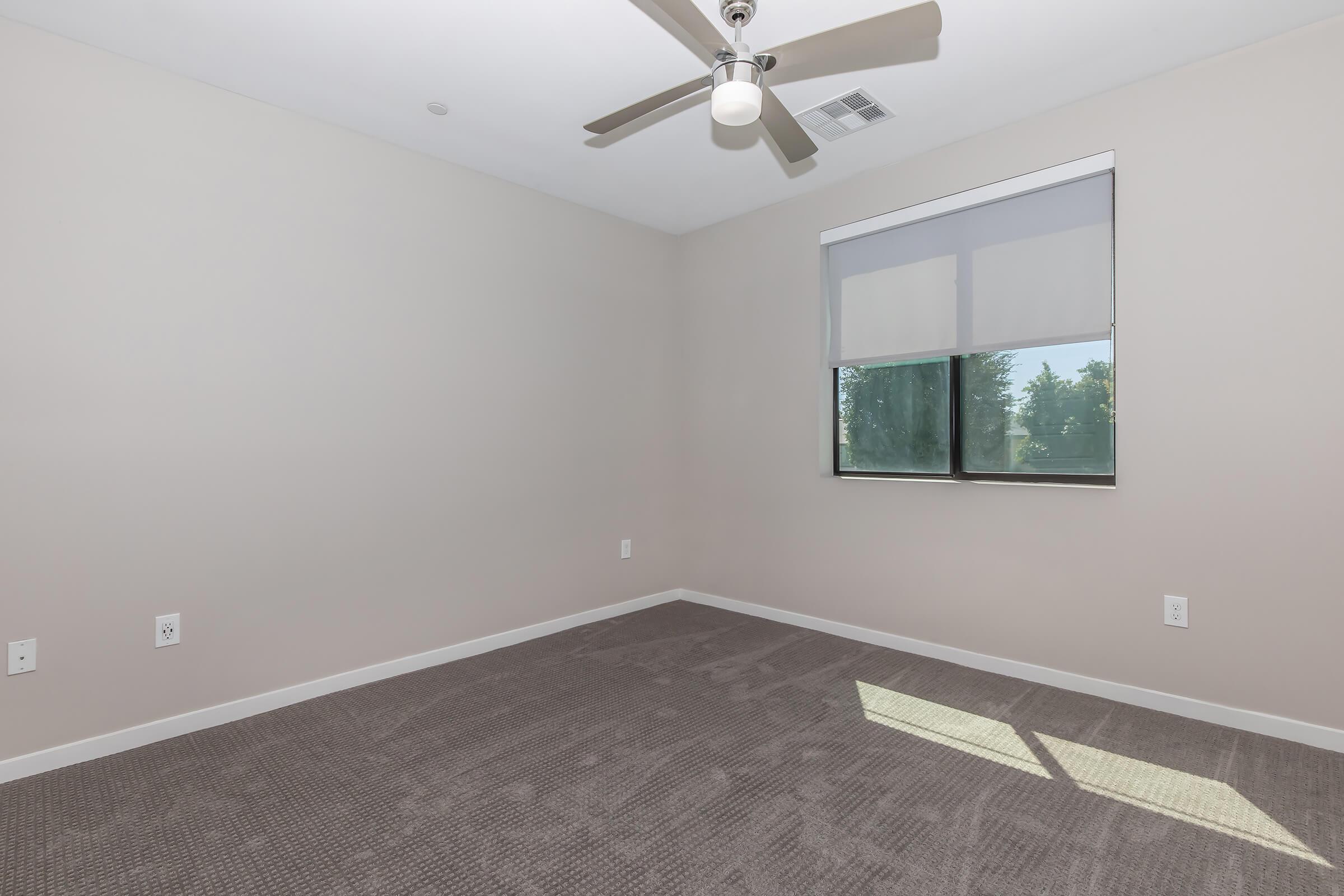 a bedroom with a large mirror