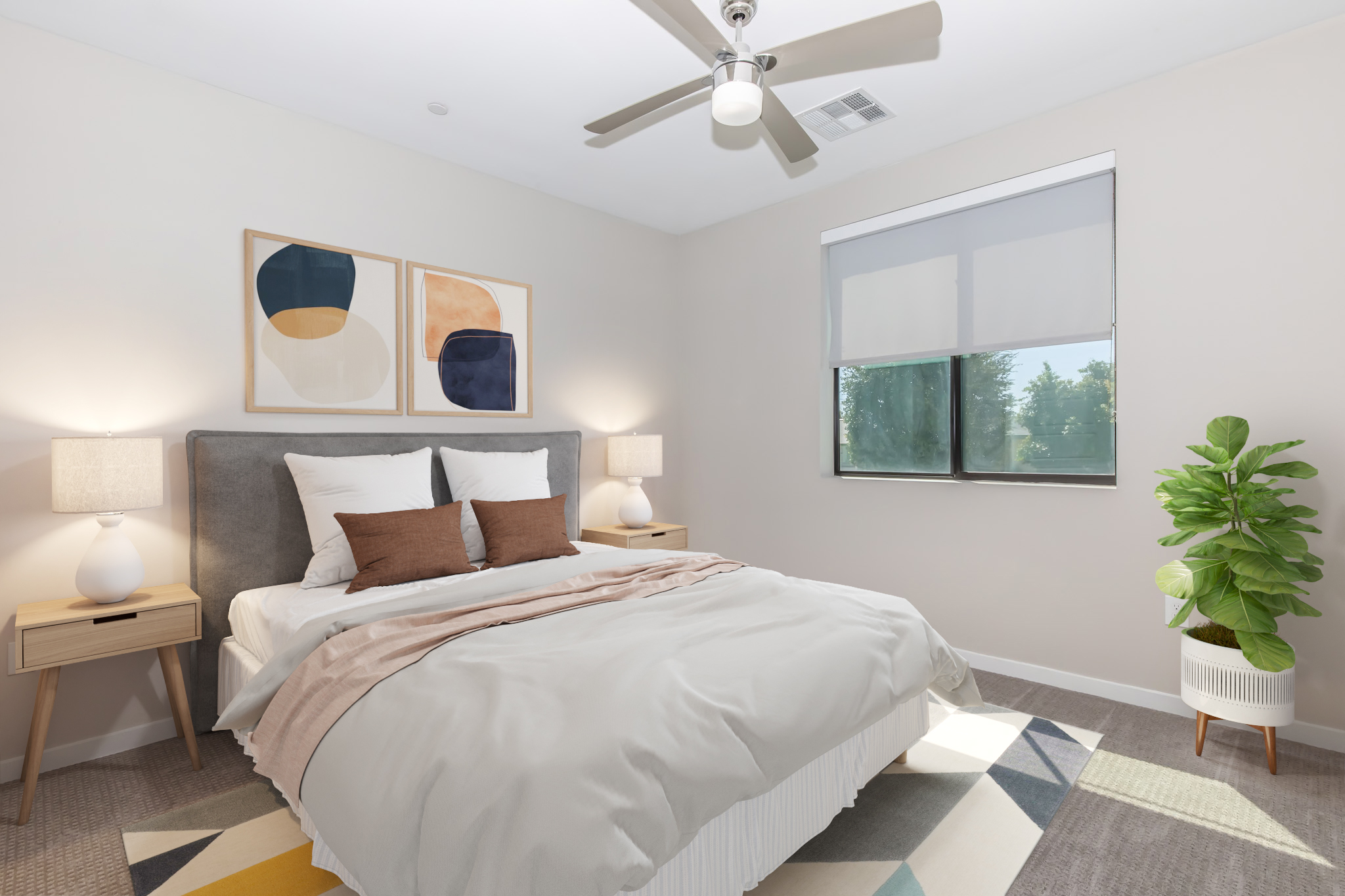 A modern bedroom featuring a queen-sized bed with light gray bedding, flanked by two bedside tables with lamps. Above the bed, there are abstract paintings in earthy tones. A large window with a light shade allows natural light in, while a potted plant adds a touch of greenery to the decor.