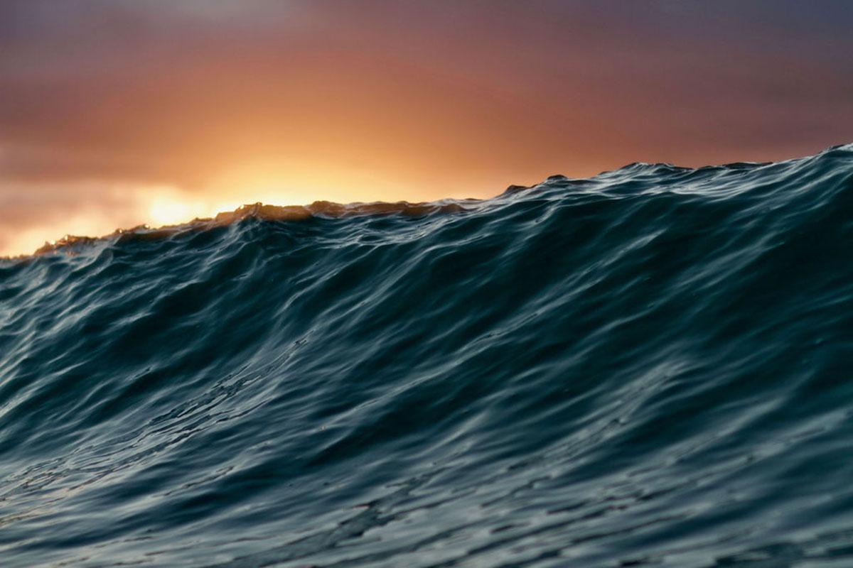 a man riding a wave in the ocean