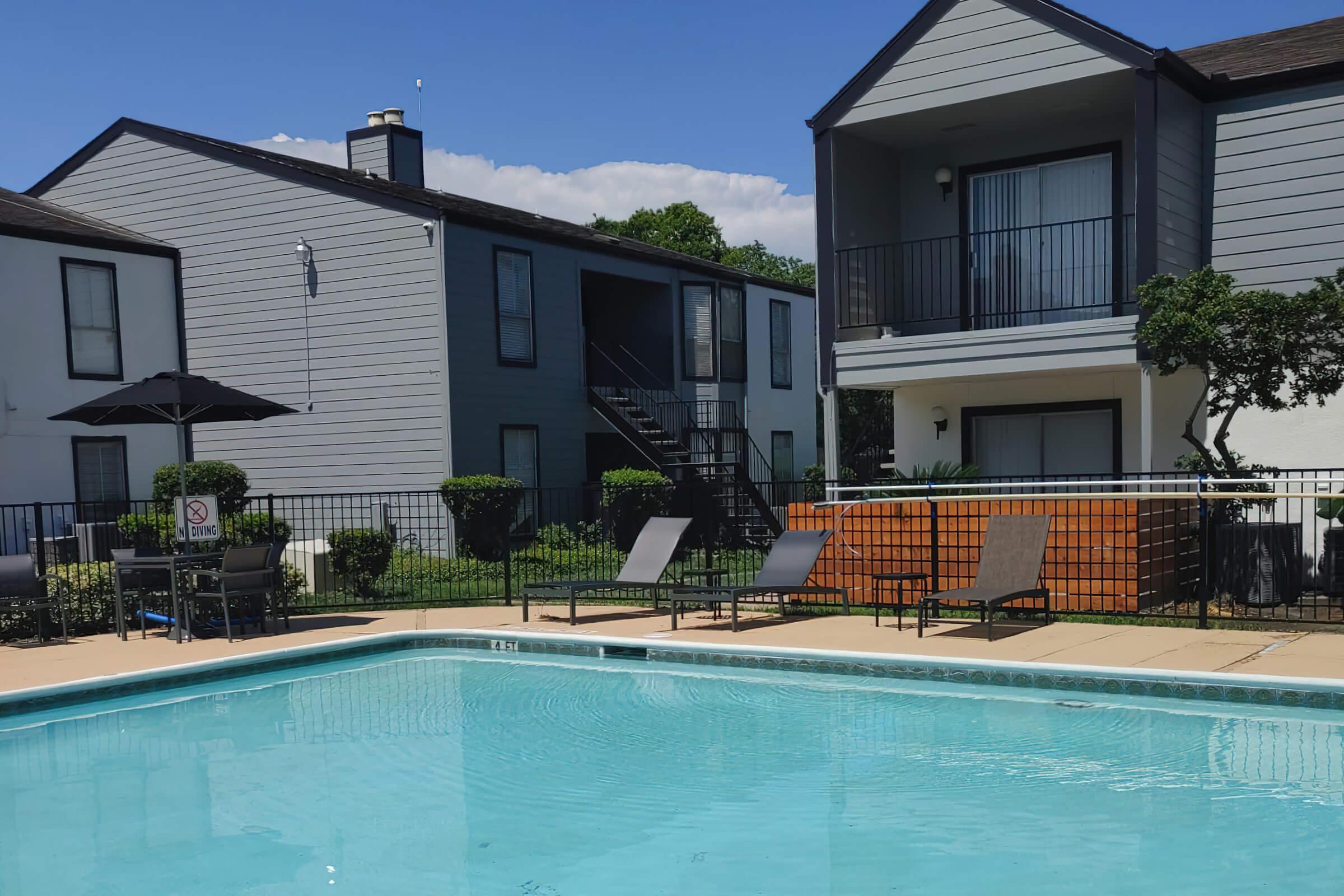 a house with a large pool of water