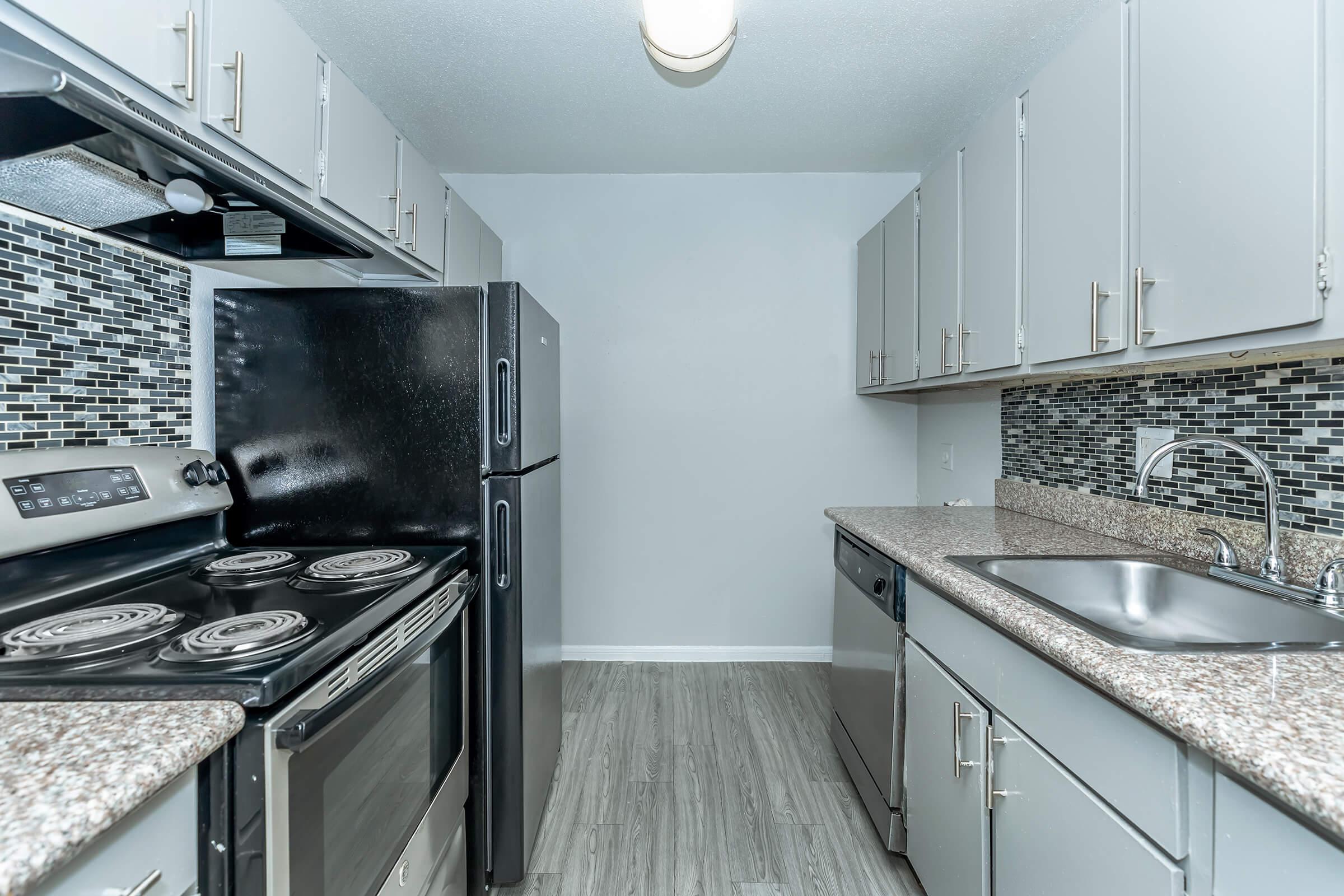 a modern kitchen with stainless steel appliances