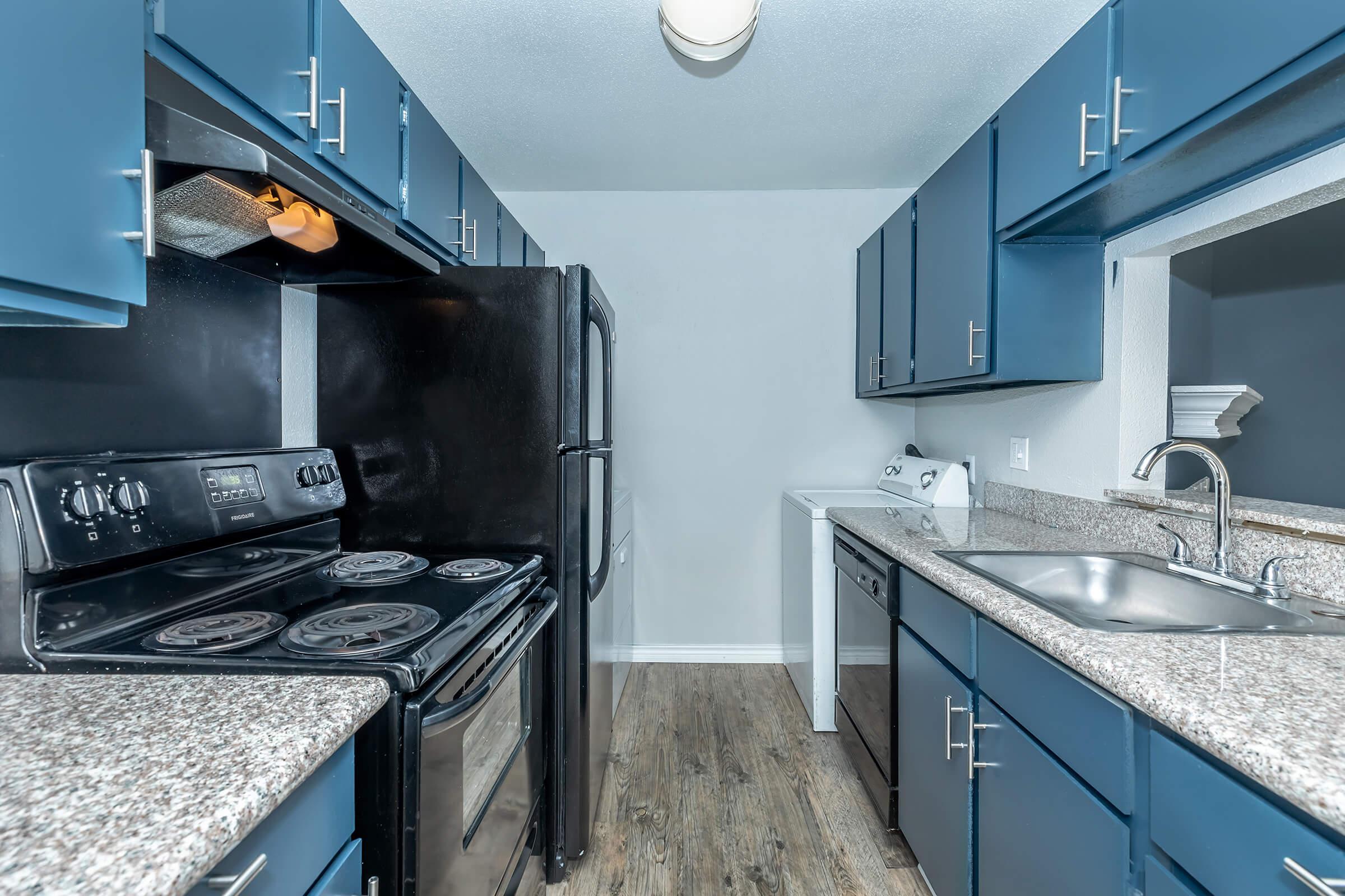 a large kitchen with stainless steel appliances