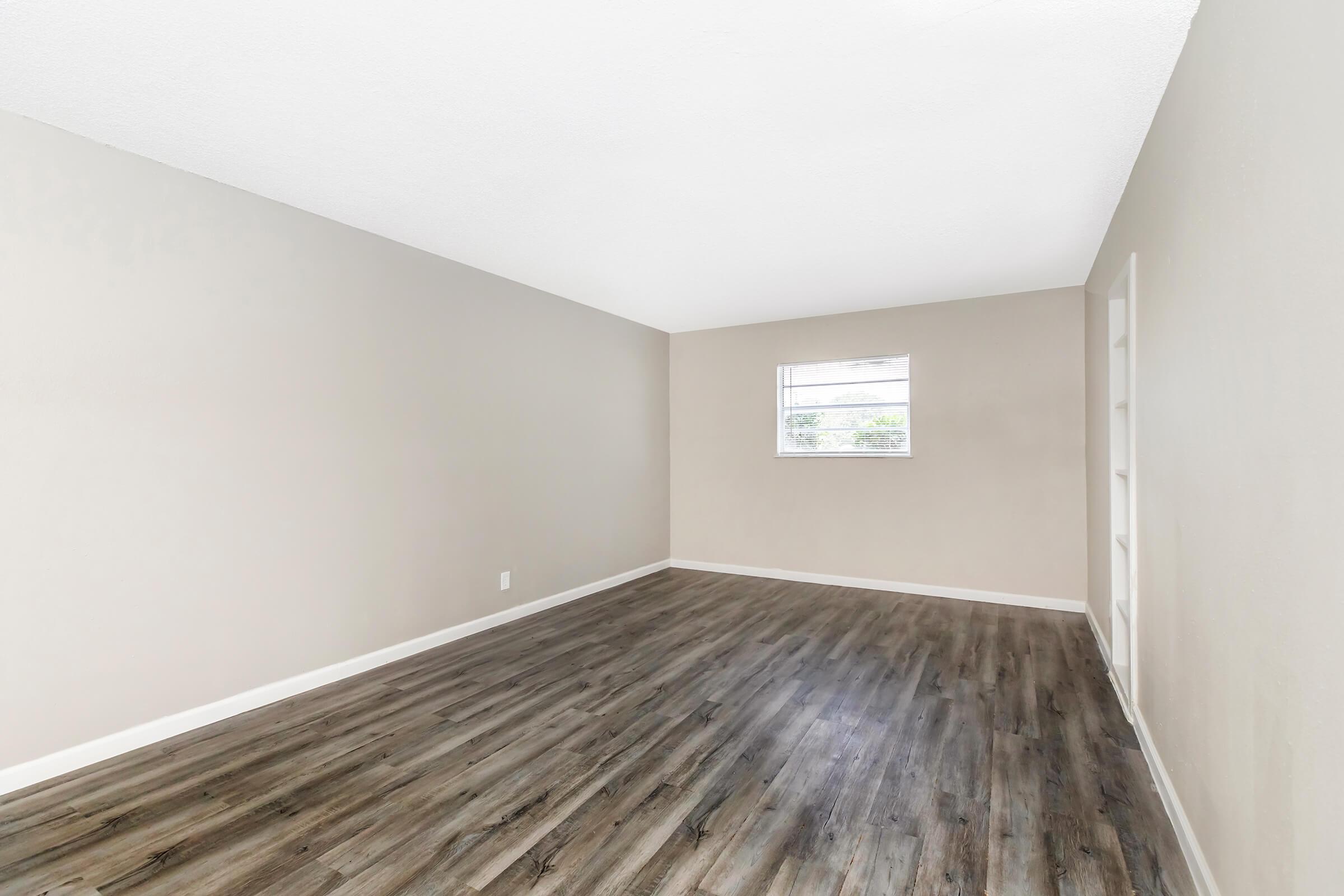 a bed with a wooden floor