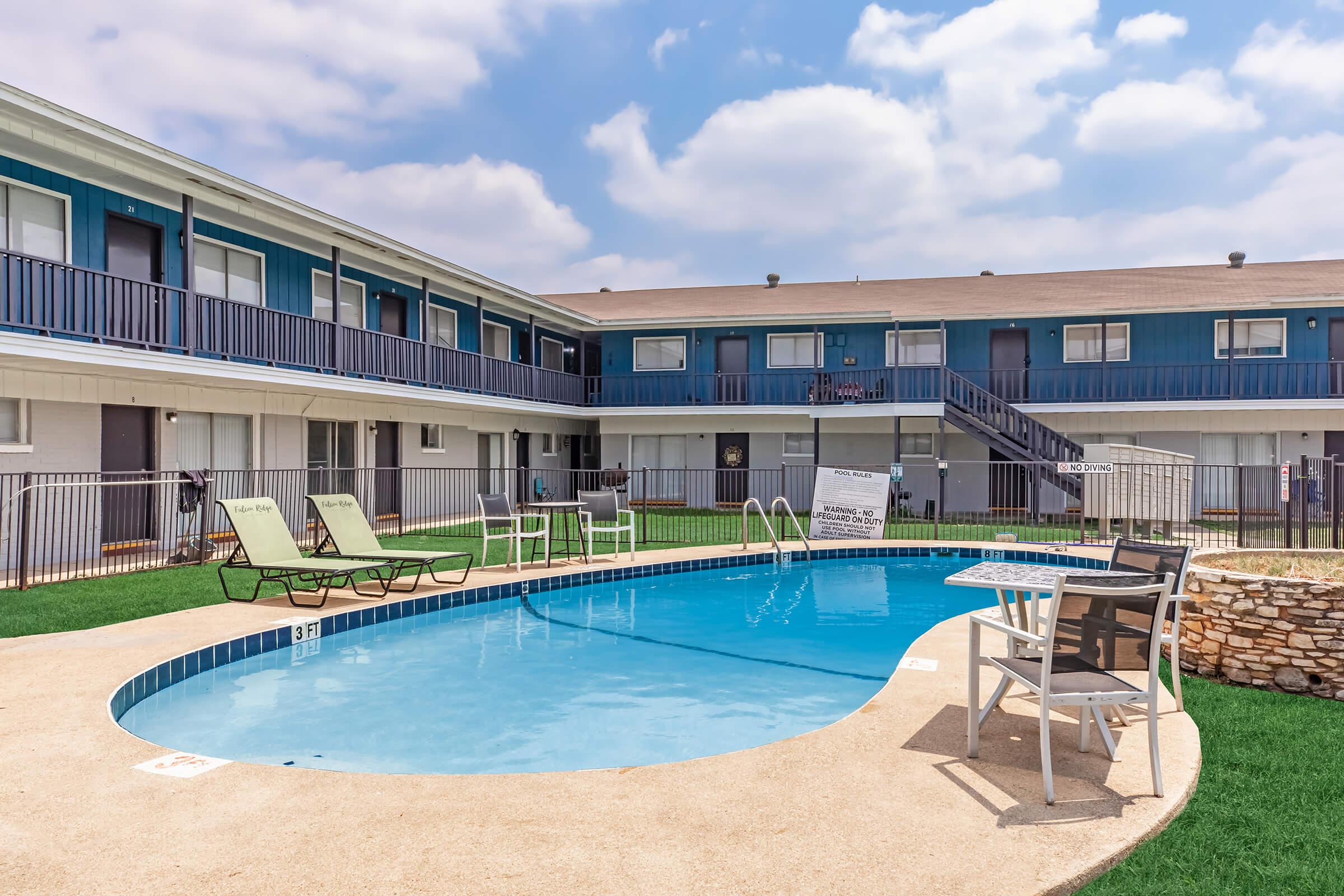 a large pool of water in front of a building