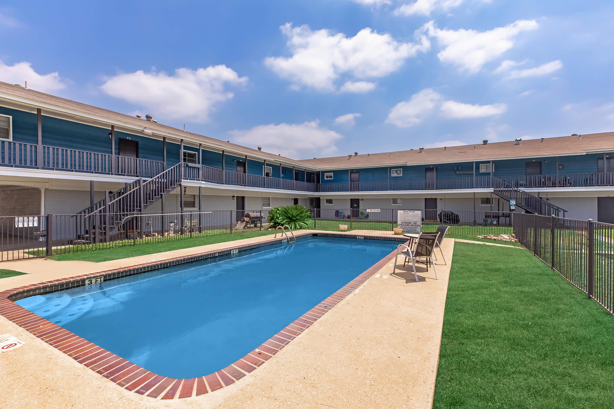 a pool next to a building