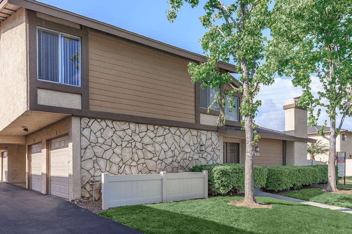 Ridgewood Village Apartment Homes community building with a white masonry wall