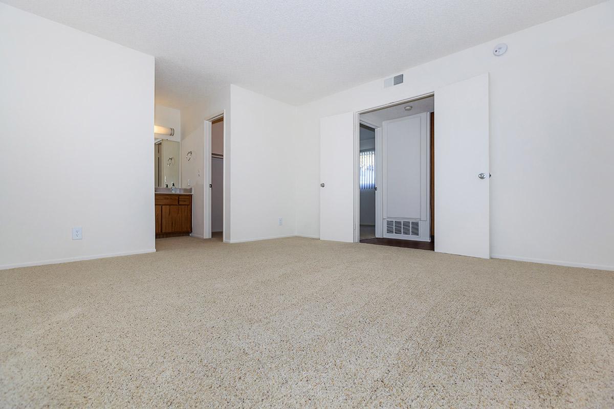 Bedroom with carpet and bathroom sink