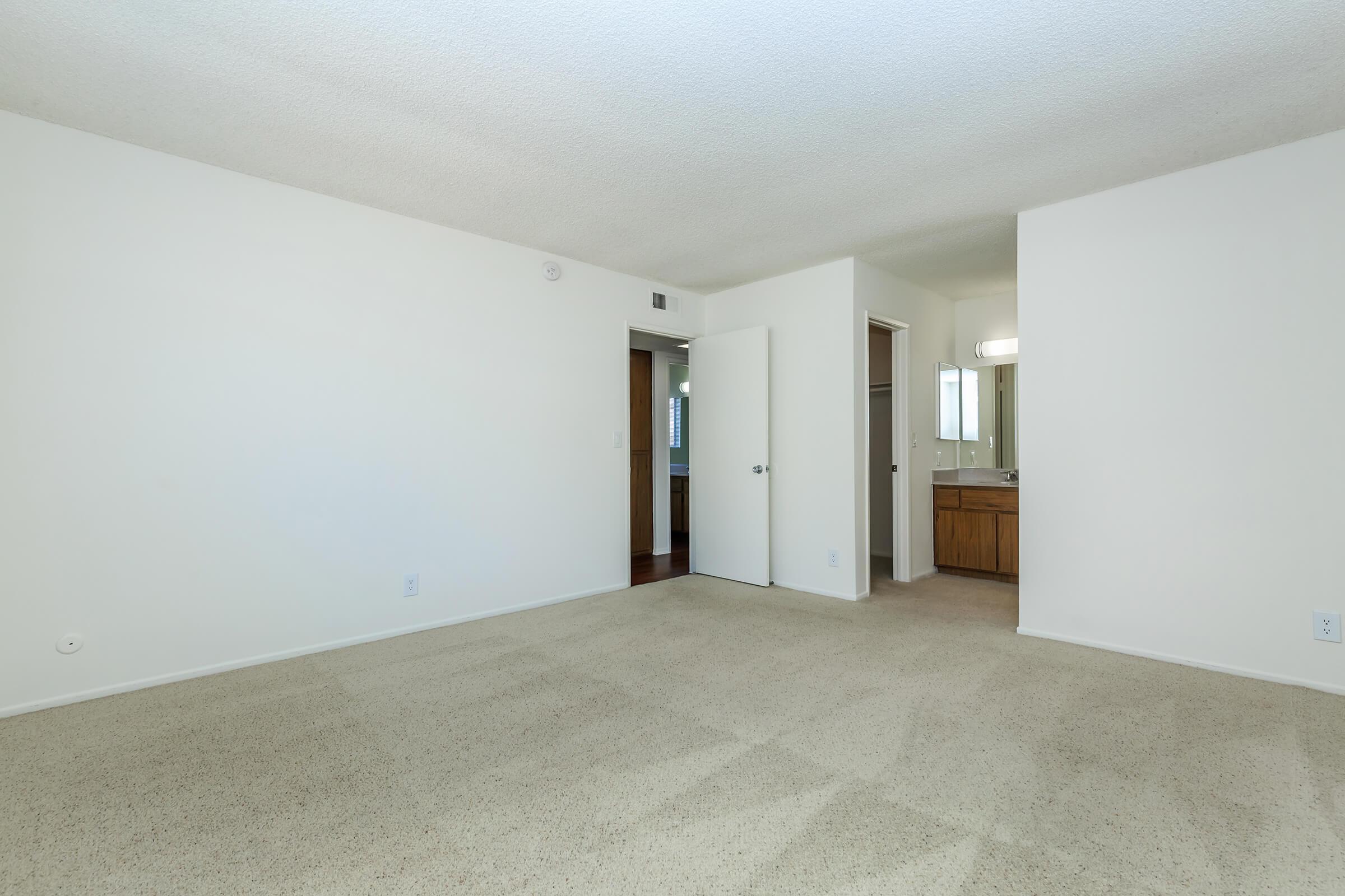 Vacant bedroom with carpet