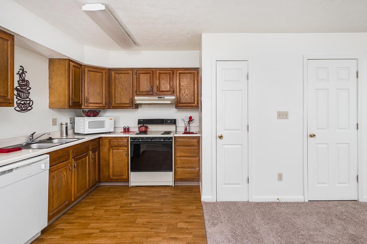 a kitchen with a wood floor