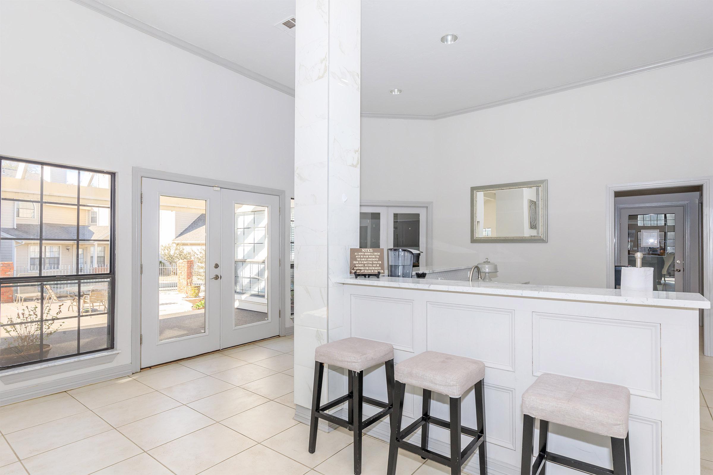 a dining room table in front of a window