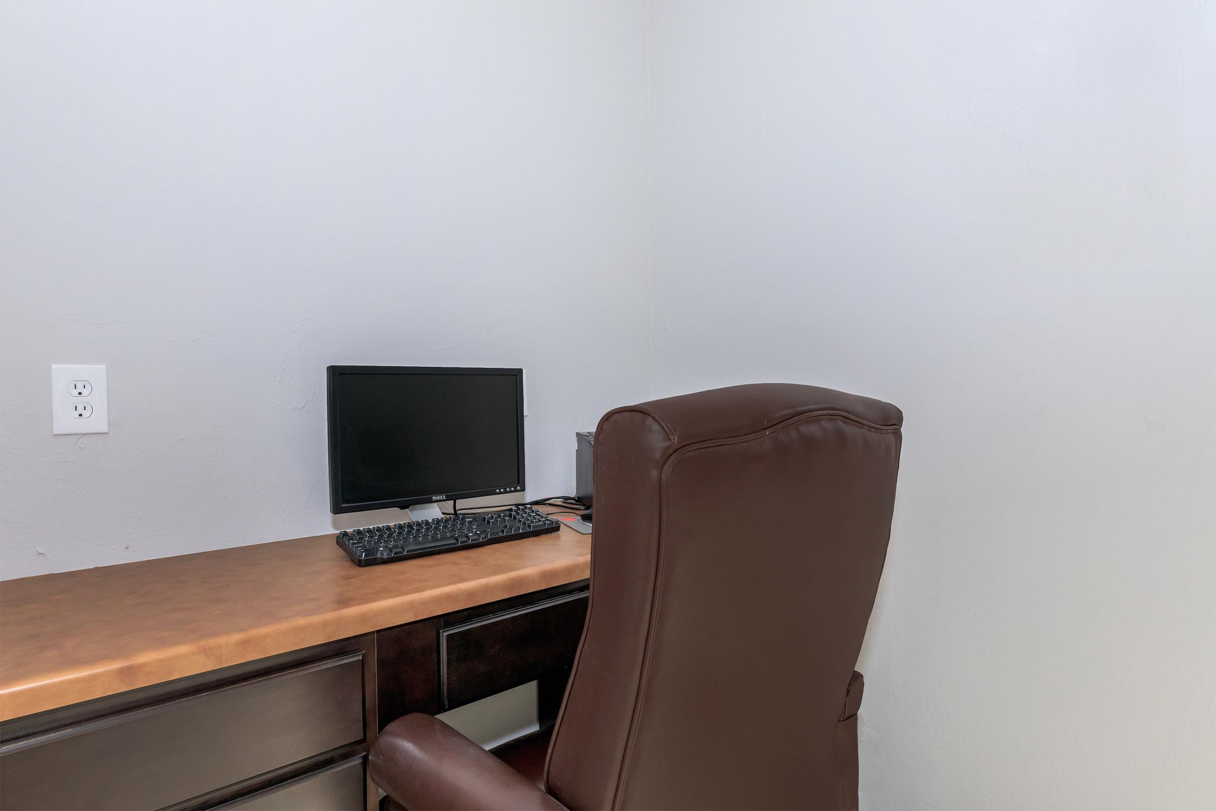 a brown leather chair in a room