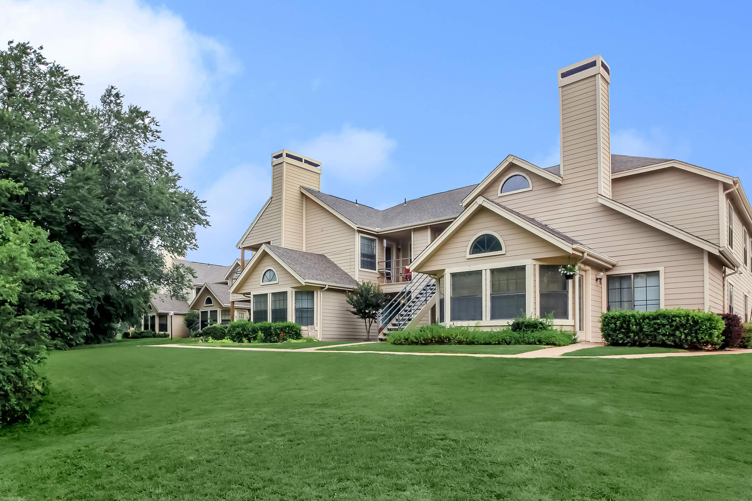 a large lawn in front of a house