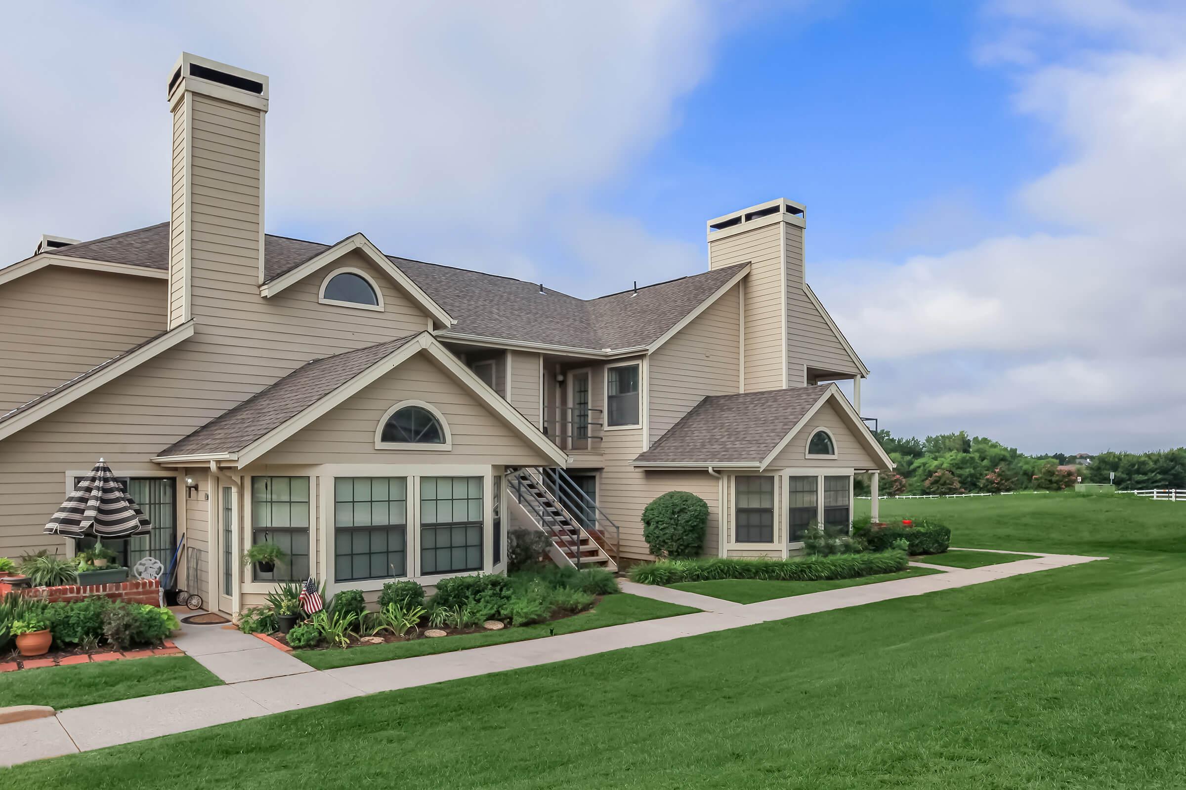 a large lawn in front of a house