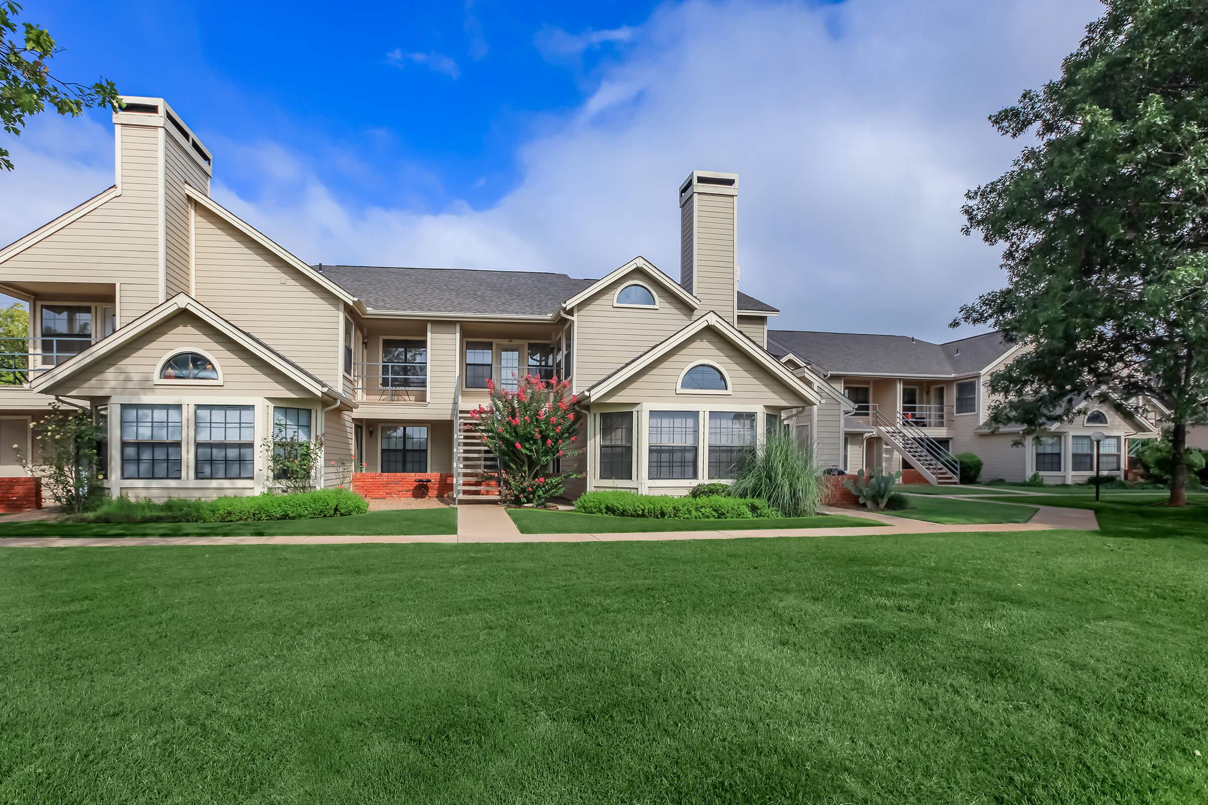 a large lawn in front of a house