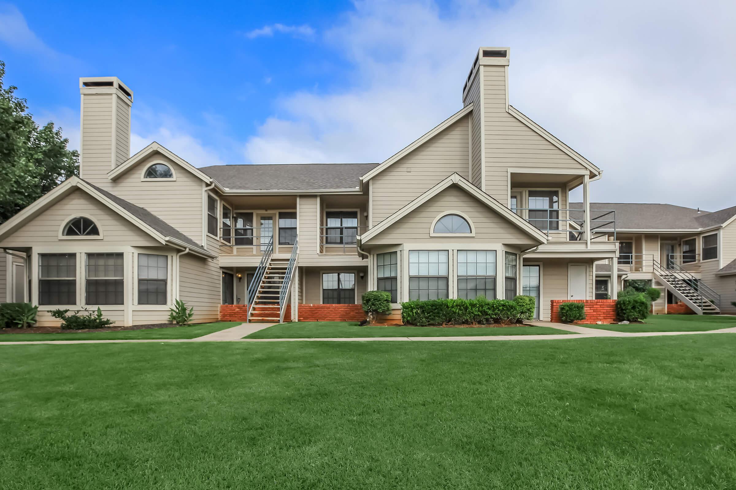 a large lawn in front of a house