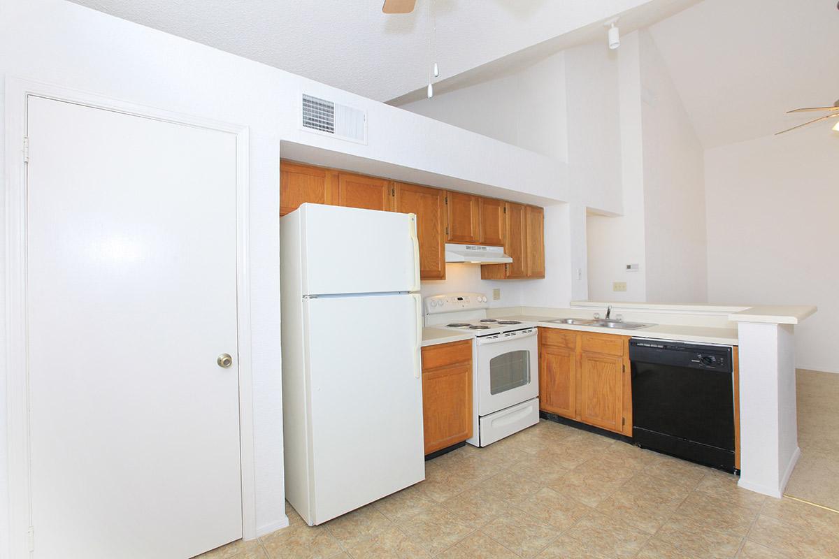 a white refrigerator freezer sitting inside of a kitchen