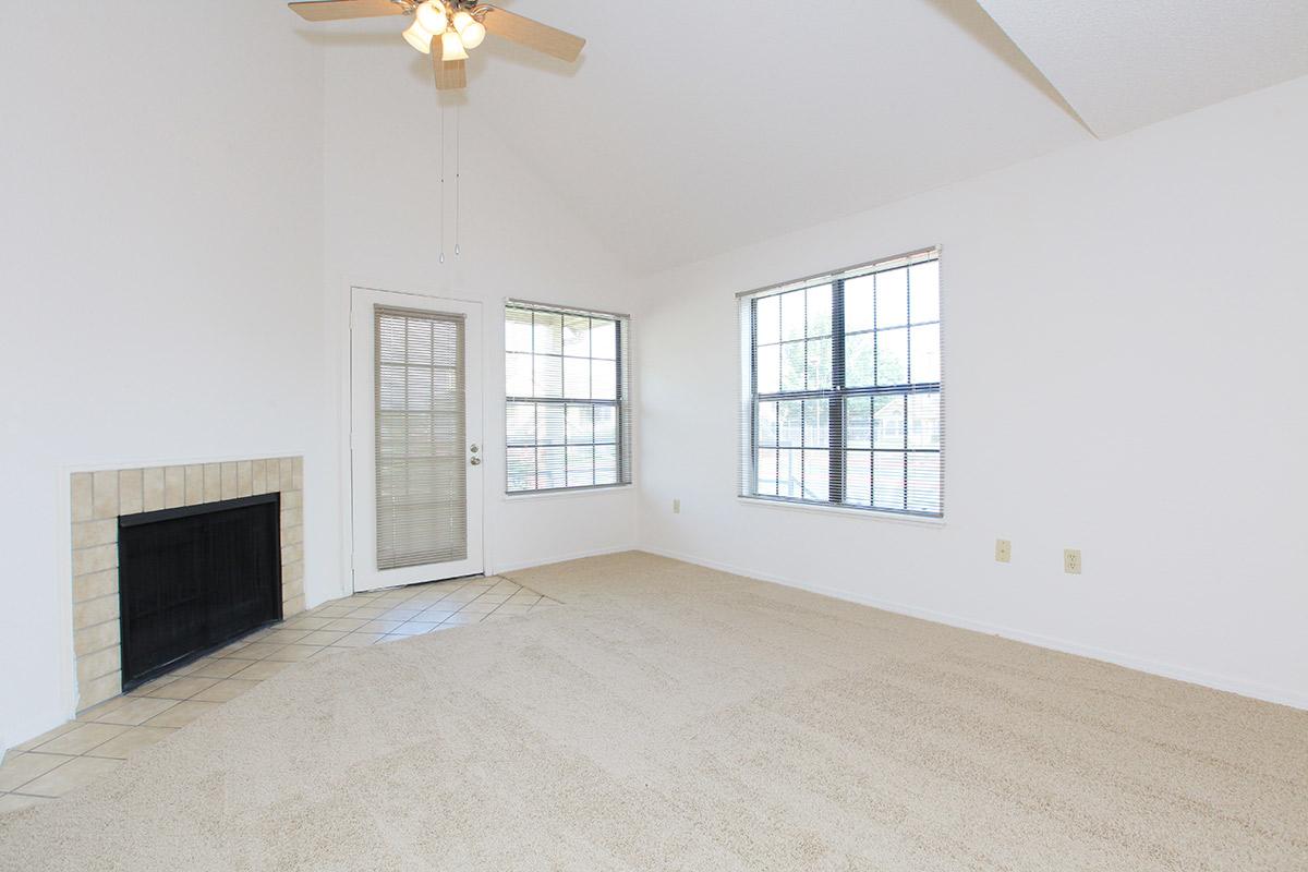 a bedroom with a bed and window in a room