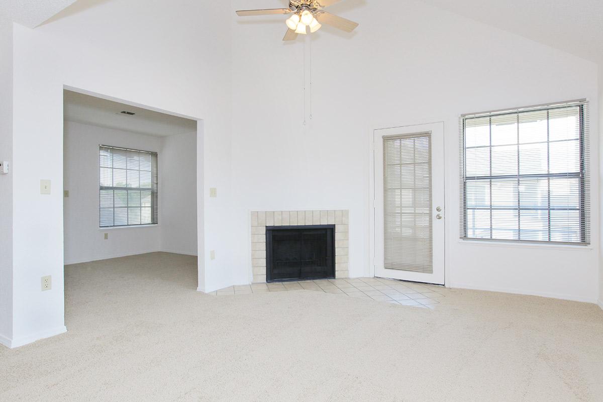 a room filled with furniture and a large window