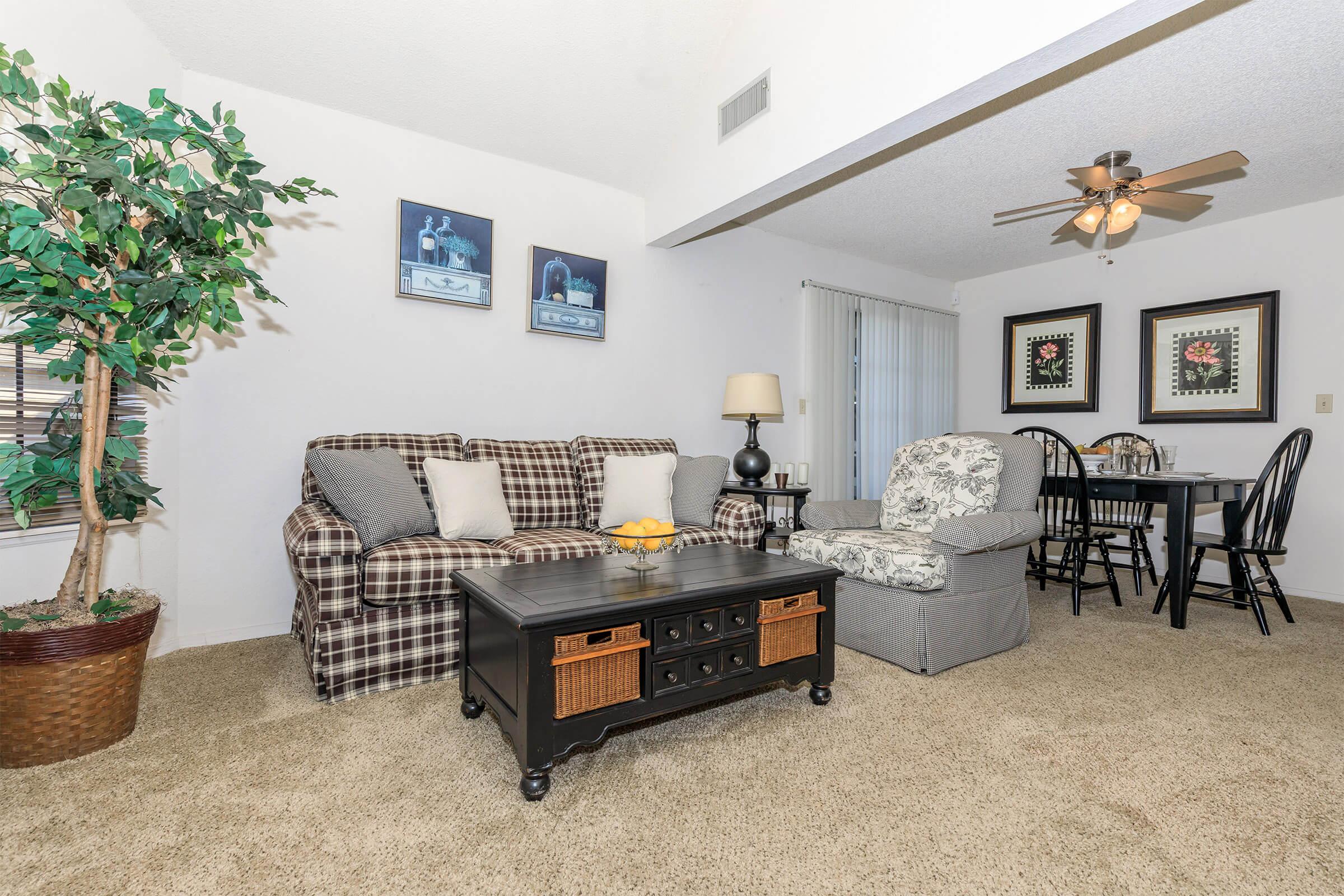 a living room filled with furniture and a fireplace