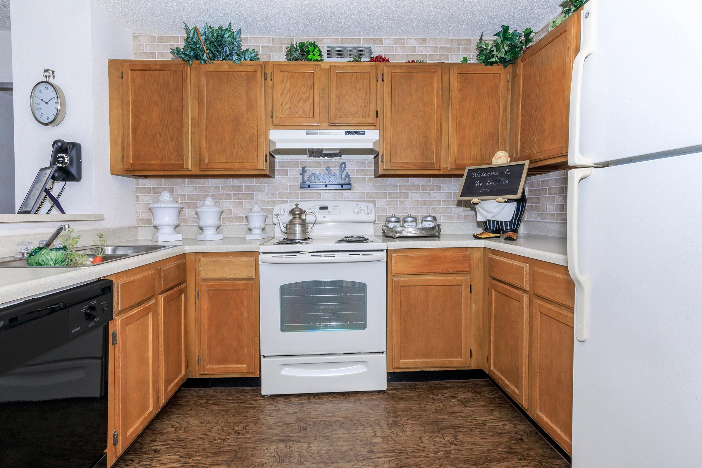 a kitchen with a stove top oven sitting inside of a refrigerator