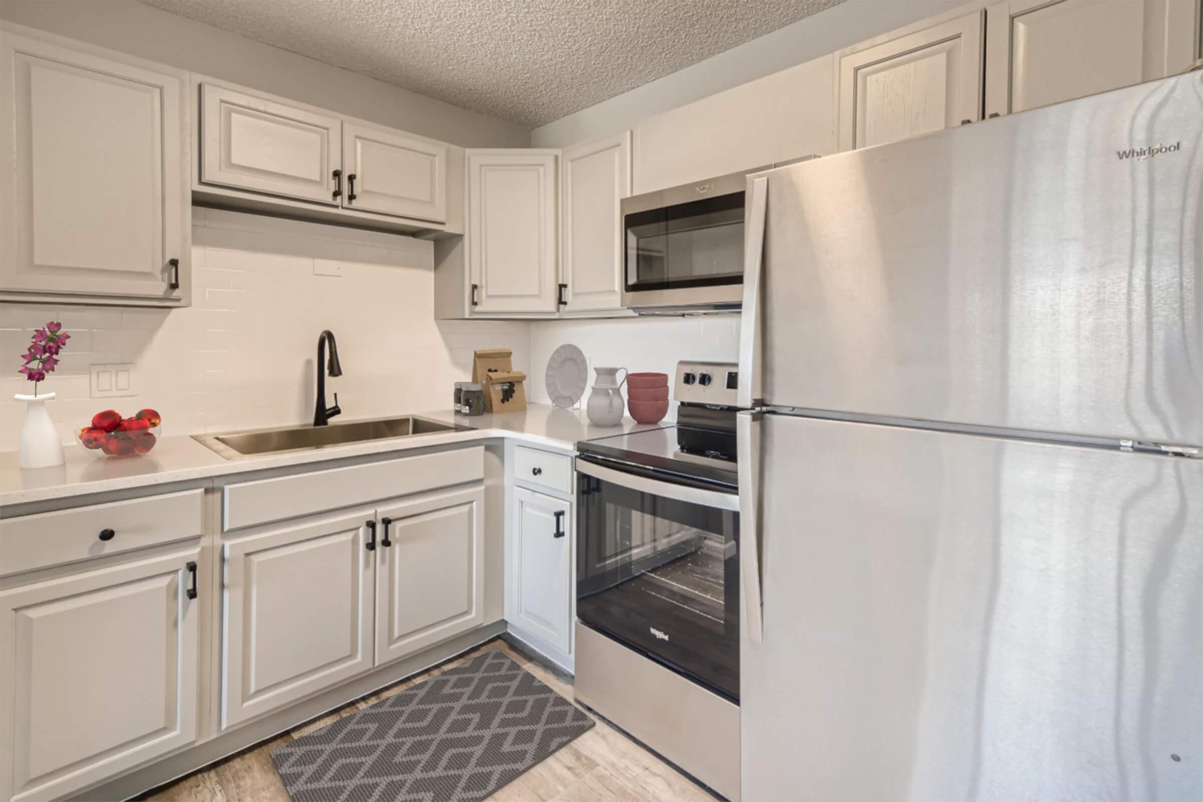 a kitchen with a stove top oven sitting inside of a refrigerator