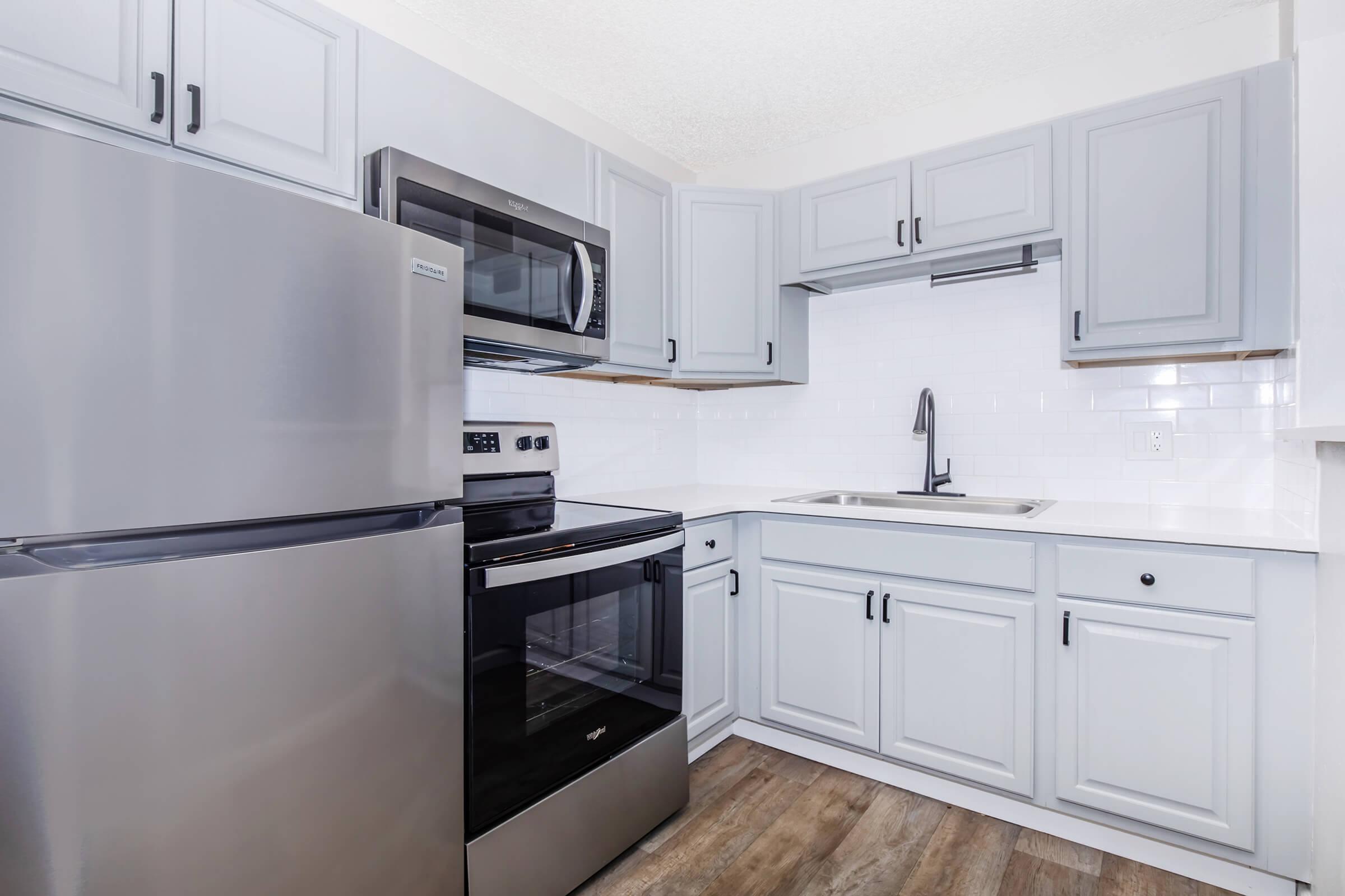 a stainless steel refrigerator in a kitchen