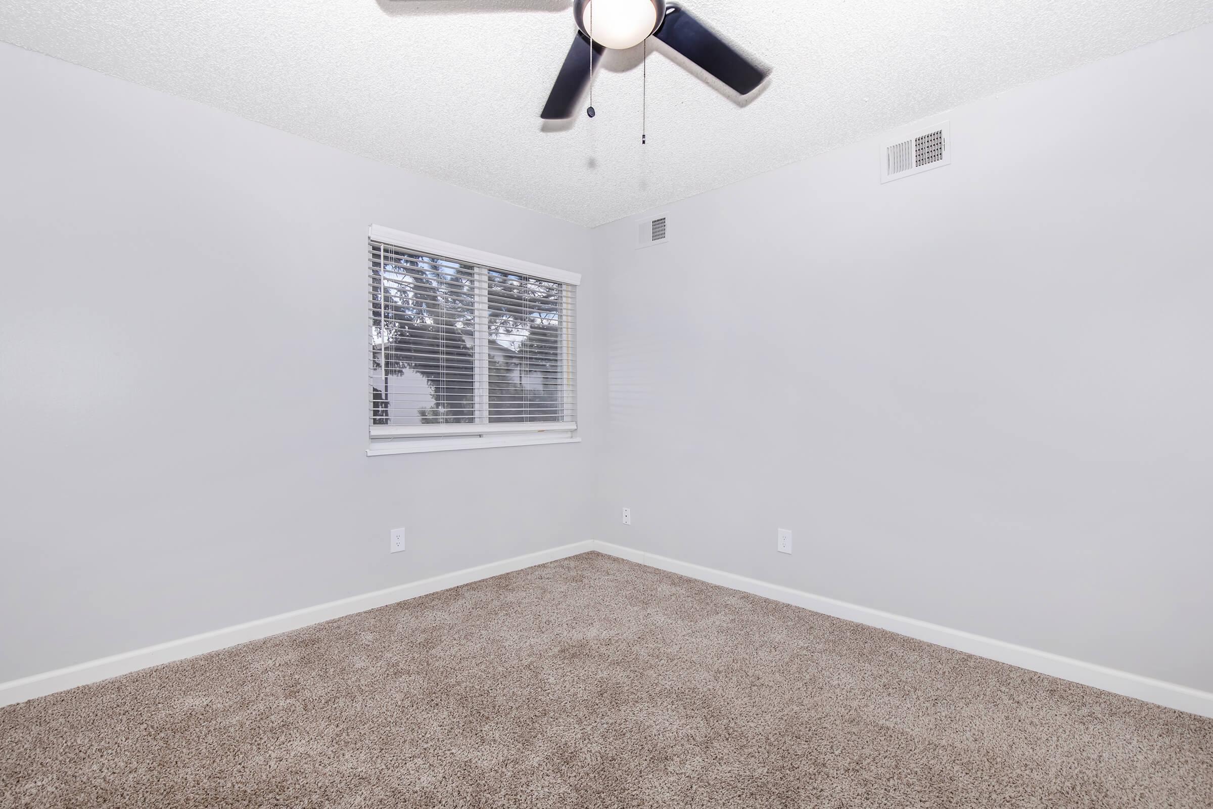 a bedroom with a large mirror