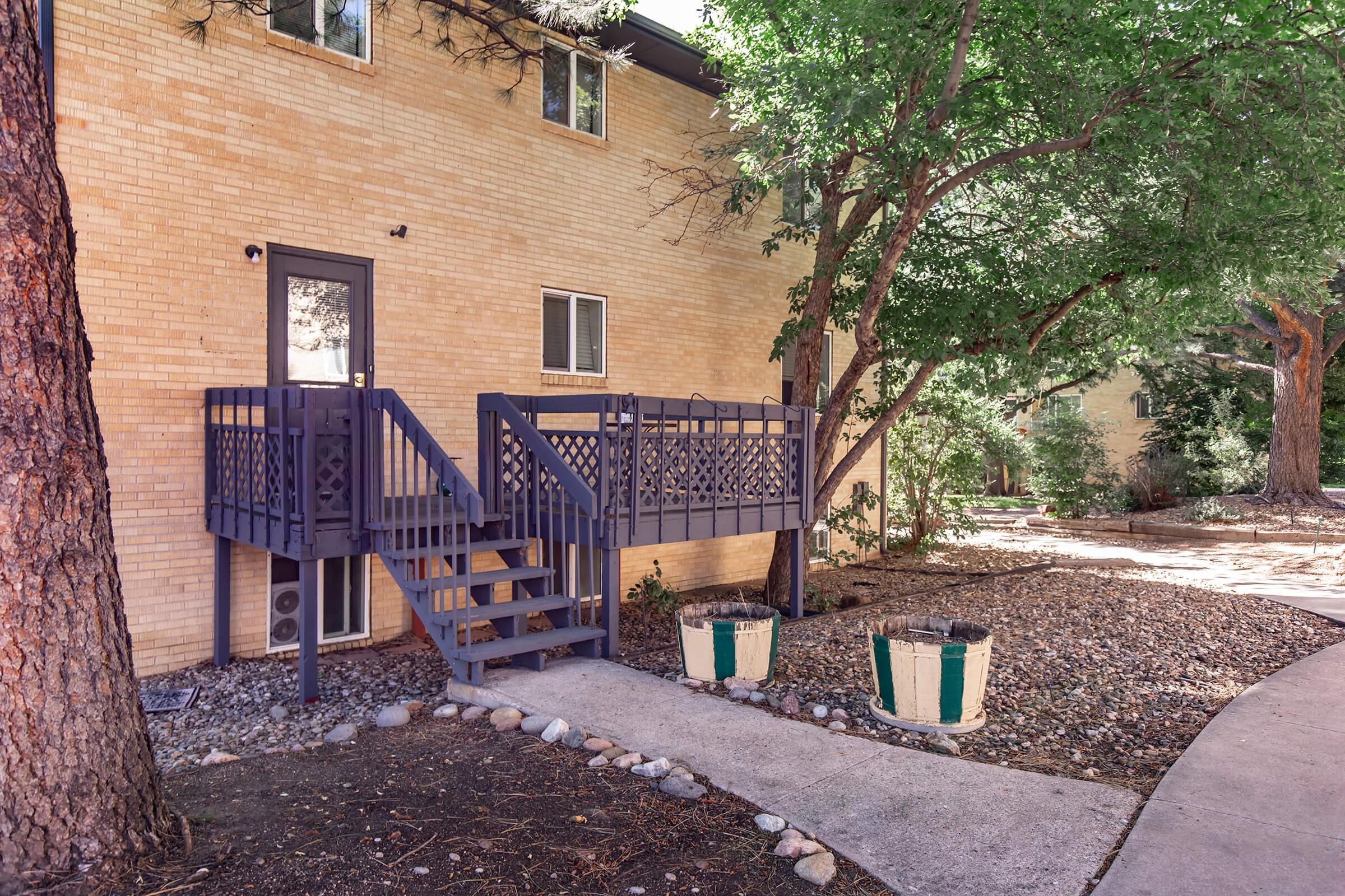 a bench in front of a brick building