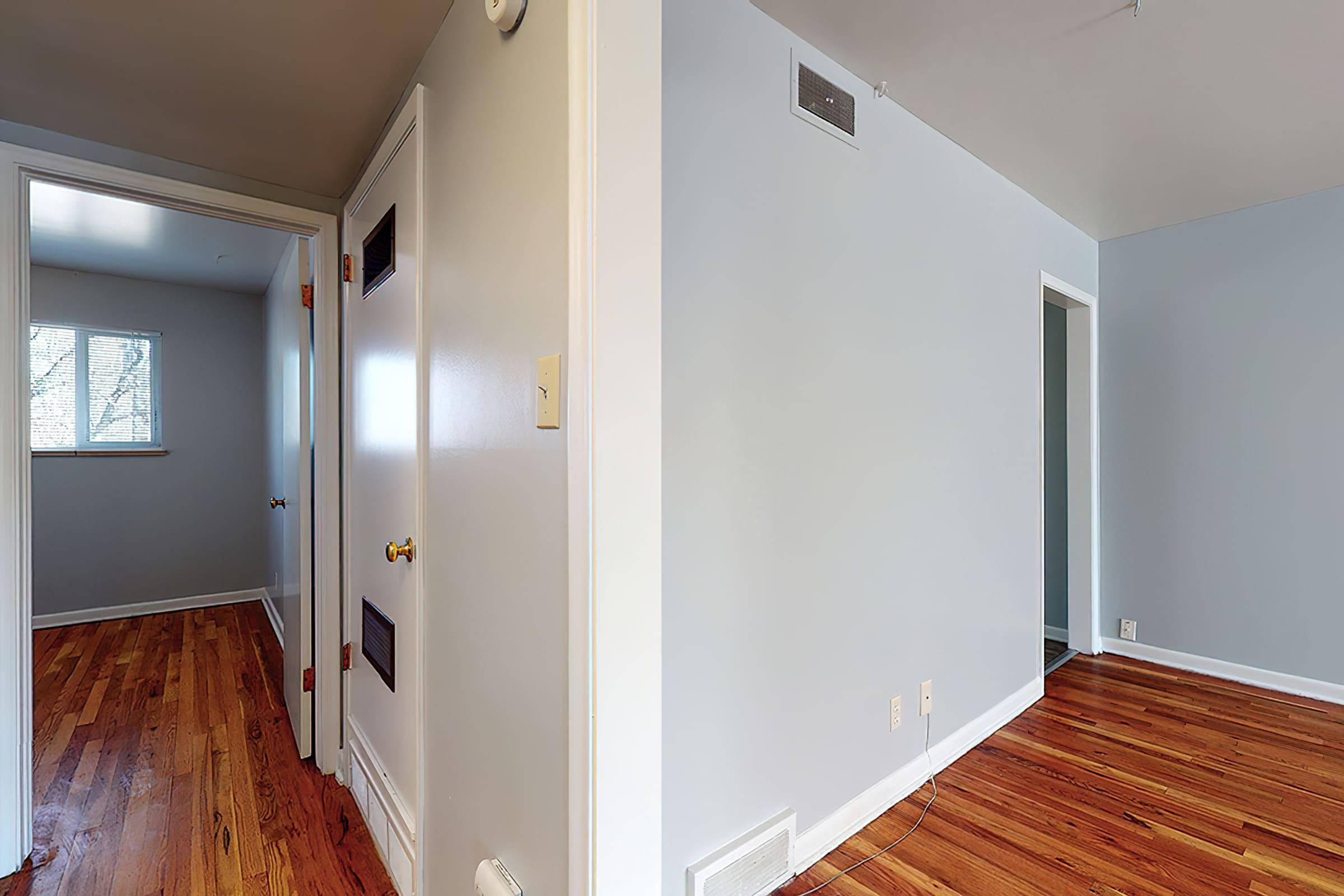 a bedroom with a large mirror