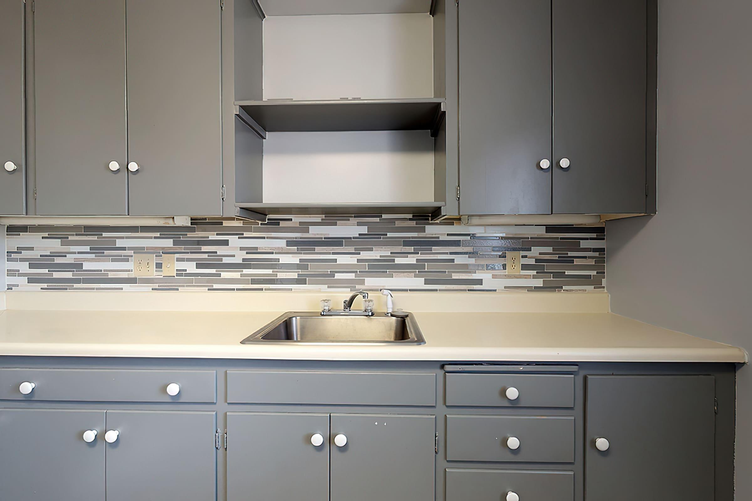 a kitchen with a sink and a microwave