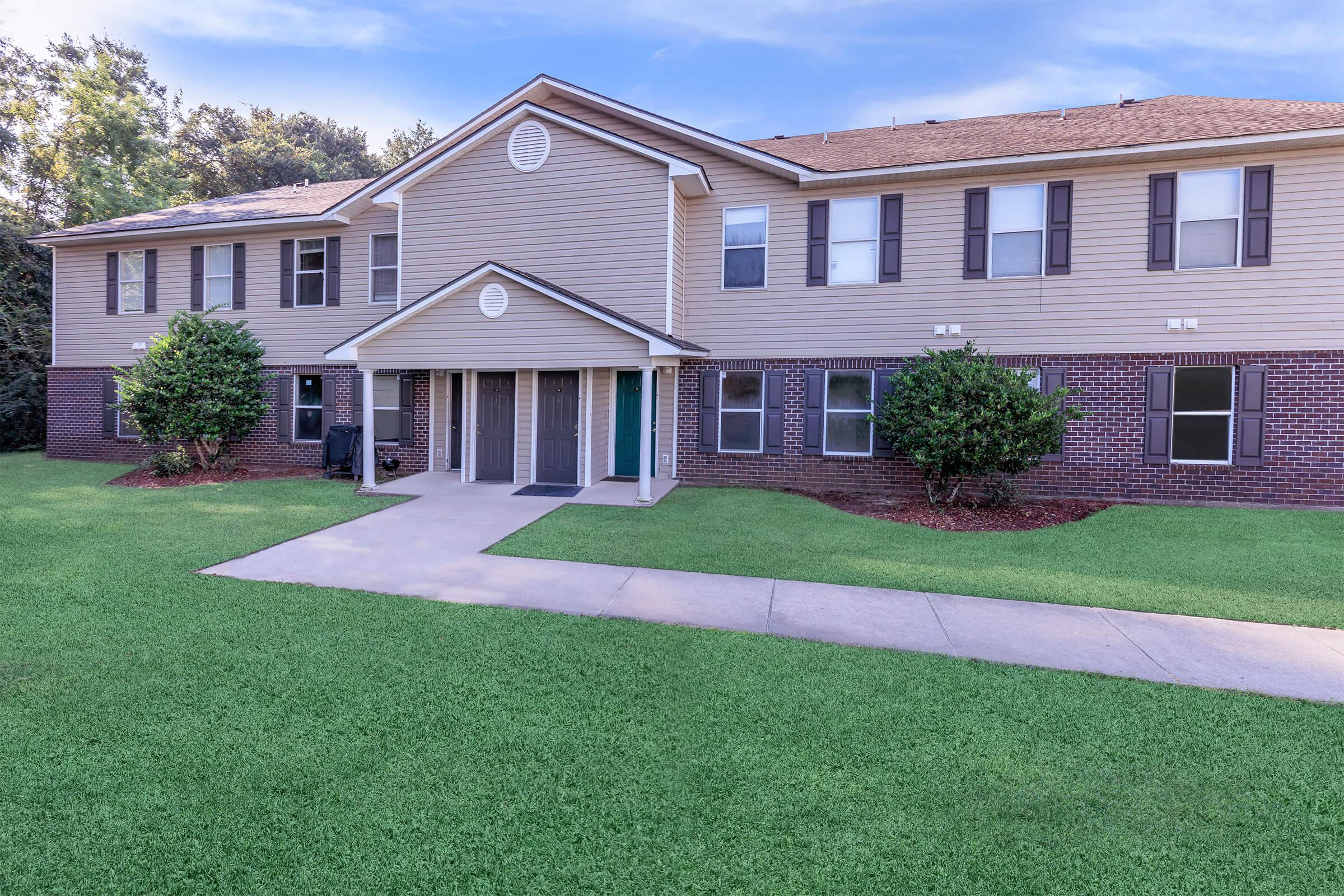 a large lawn in front of a house