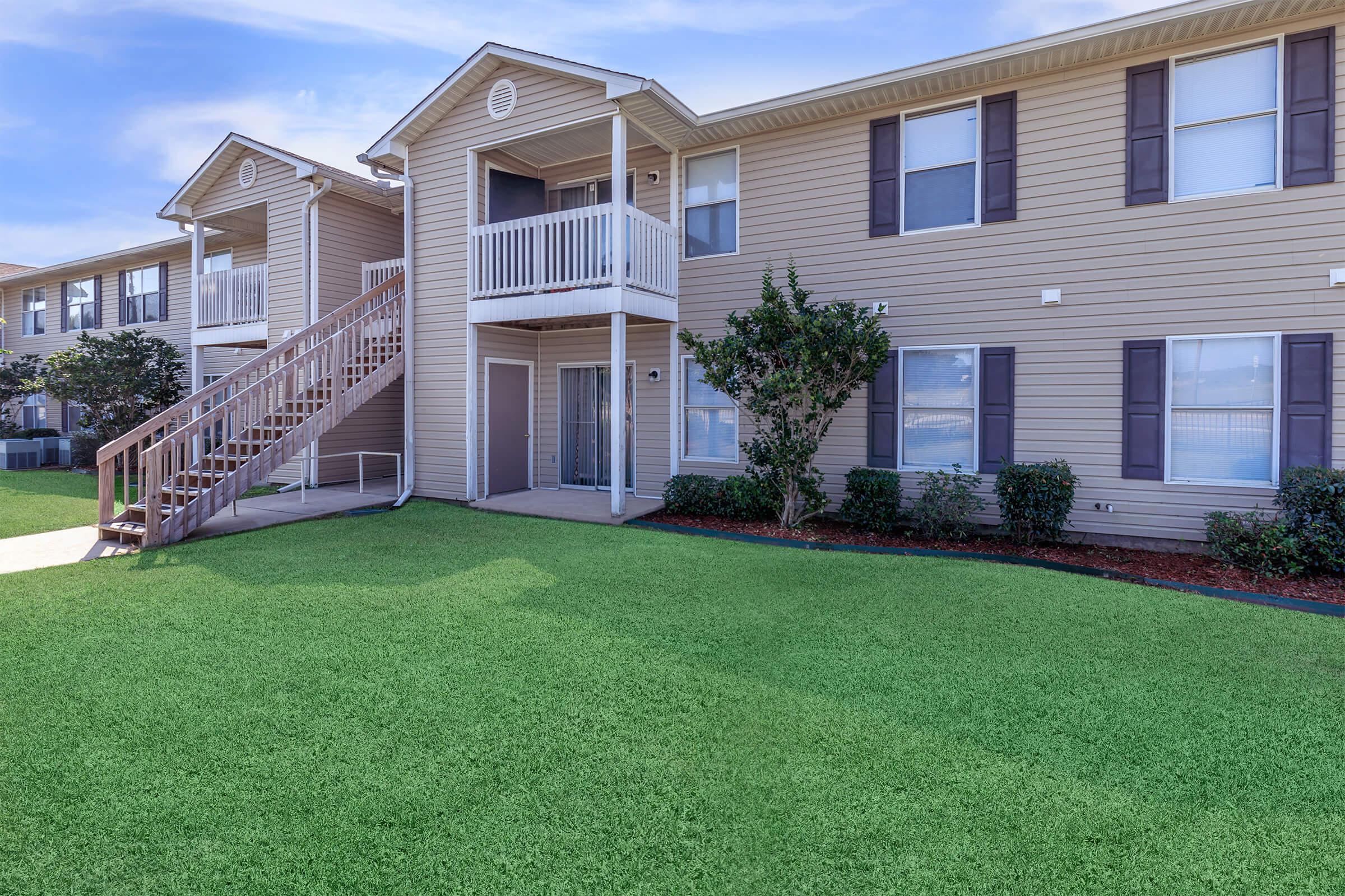 a large lawn in front of a house