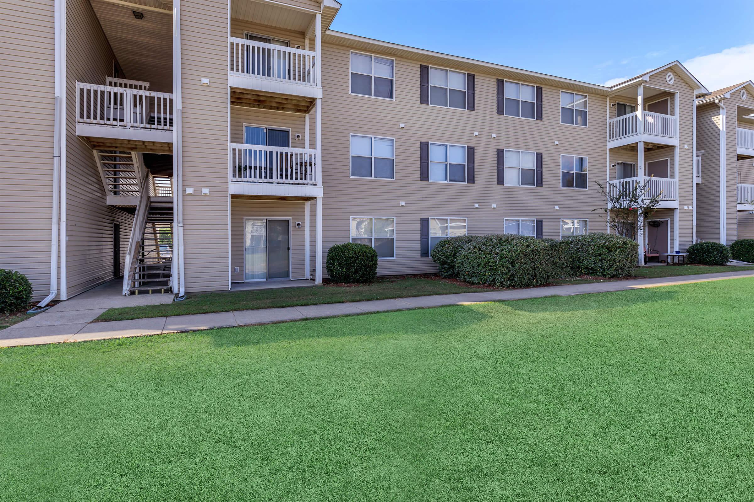 a large lawn in front of a building