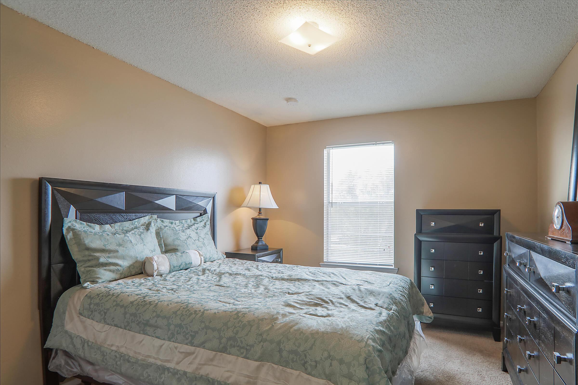 a bedroom with a large bed in a room