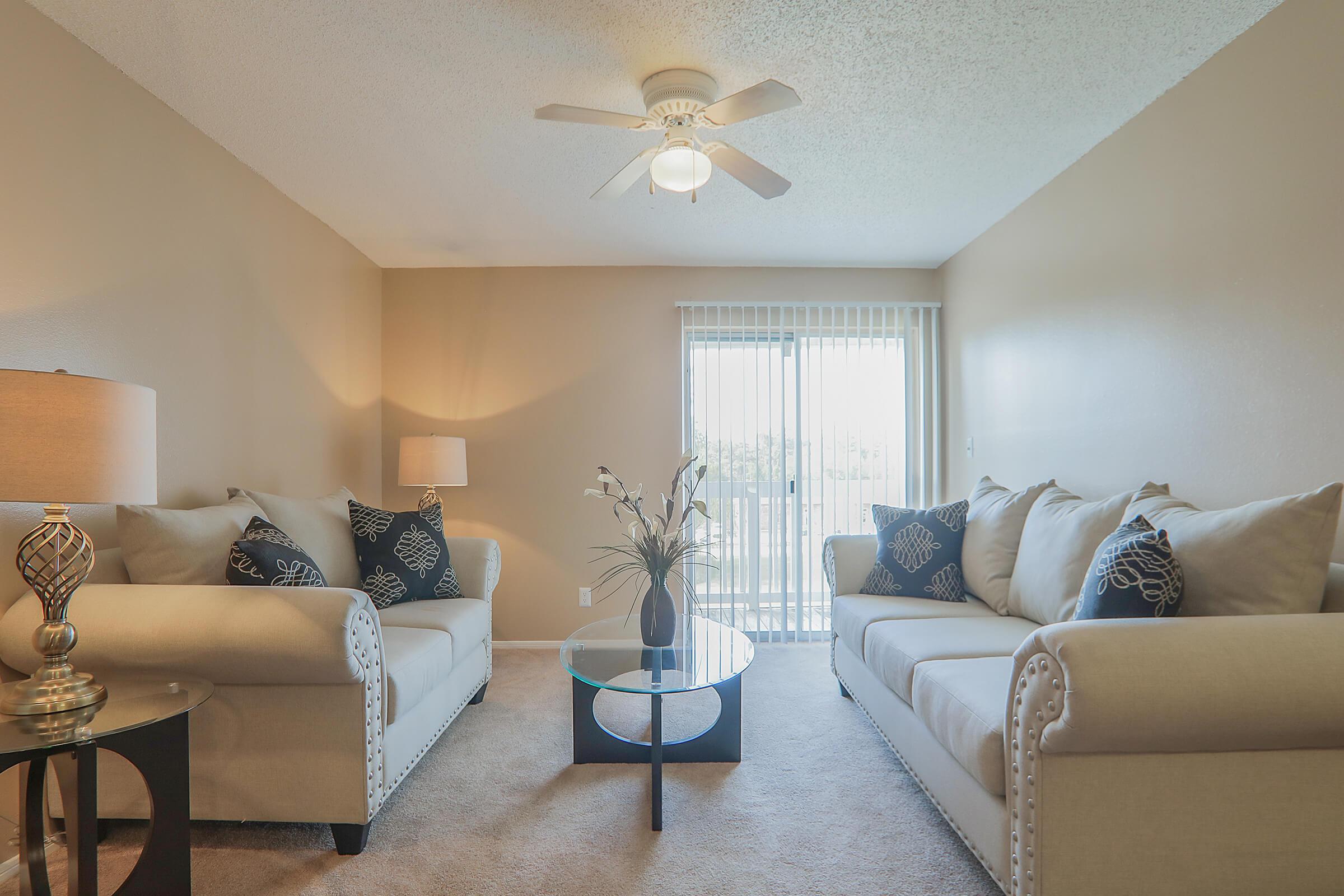 a living room filled with furniture and a fireplace