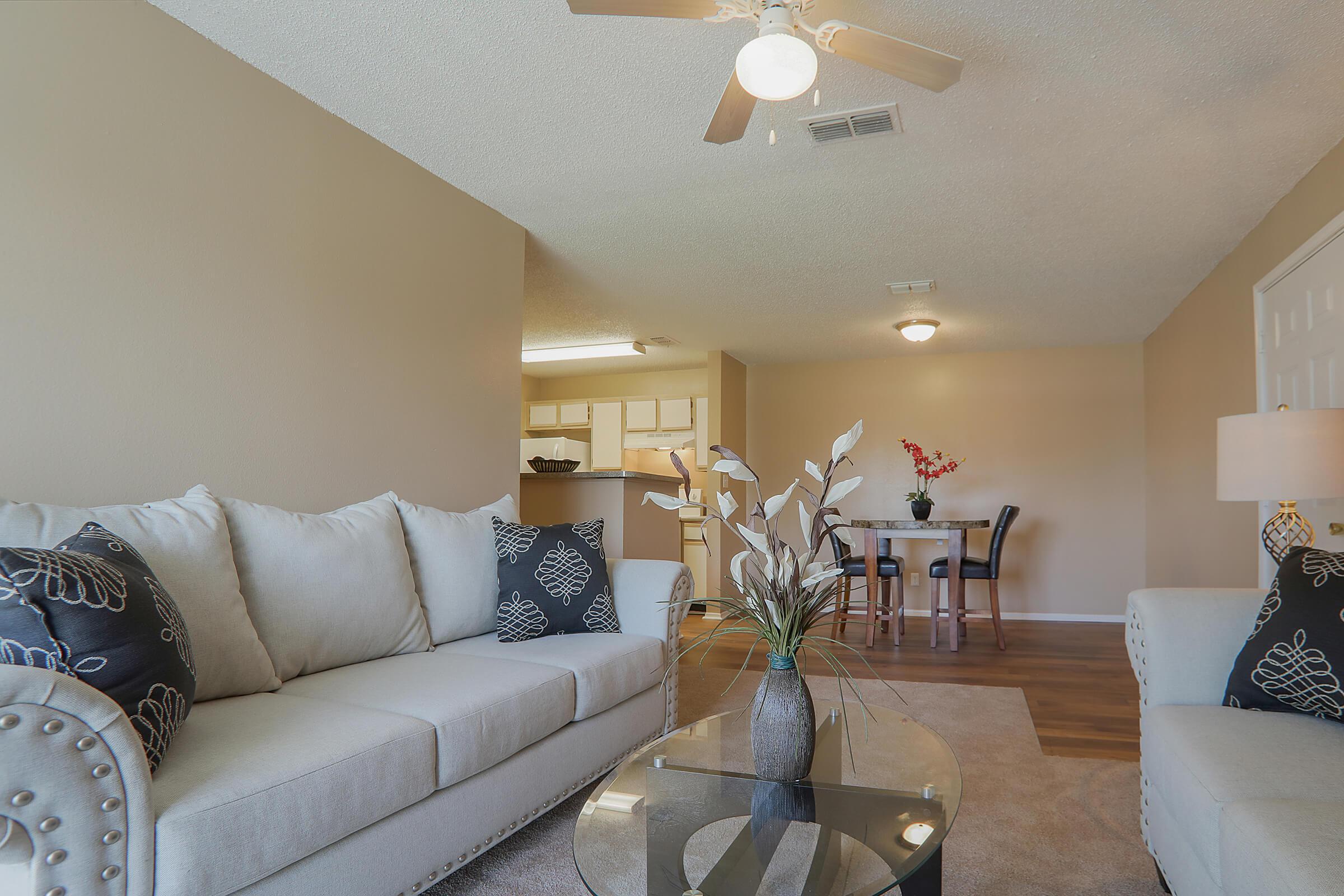 a living room filled with furniture and decor