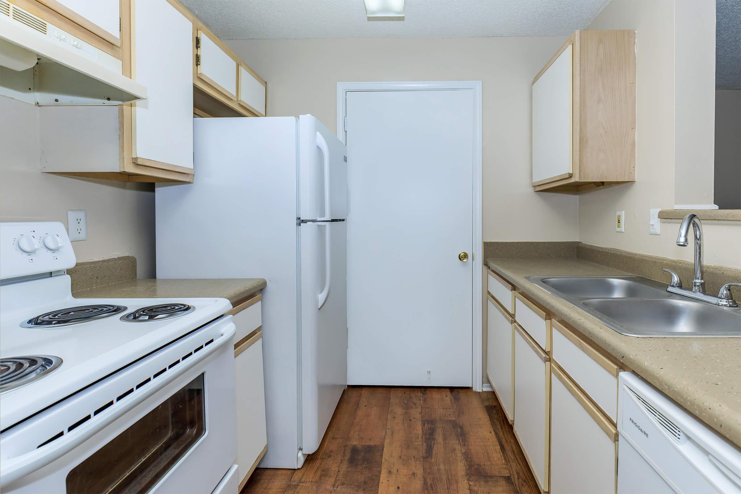 a kitchen with a stove and a sink