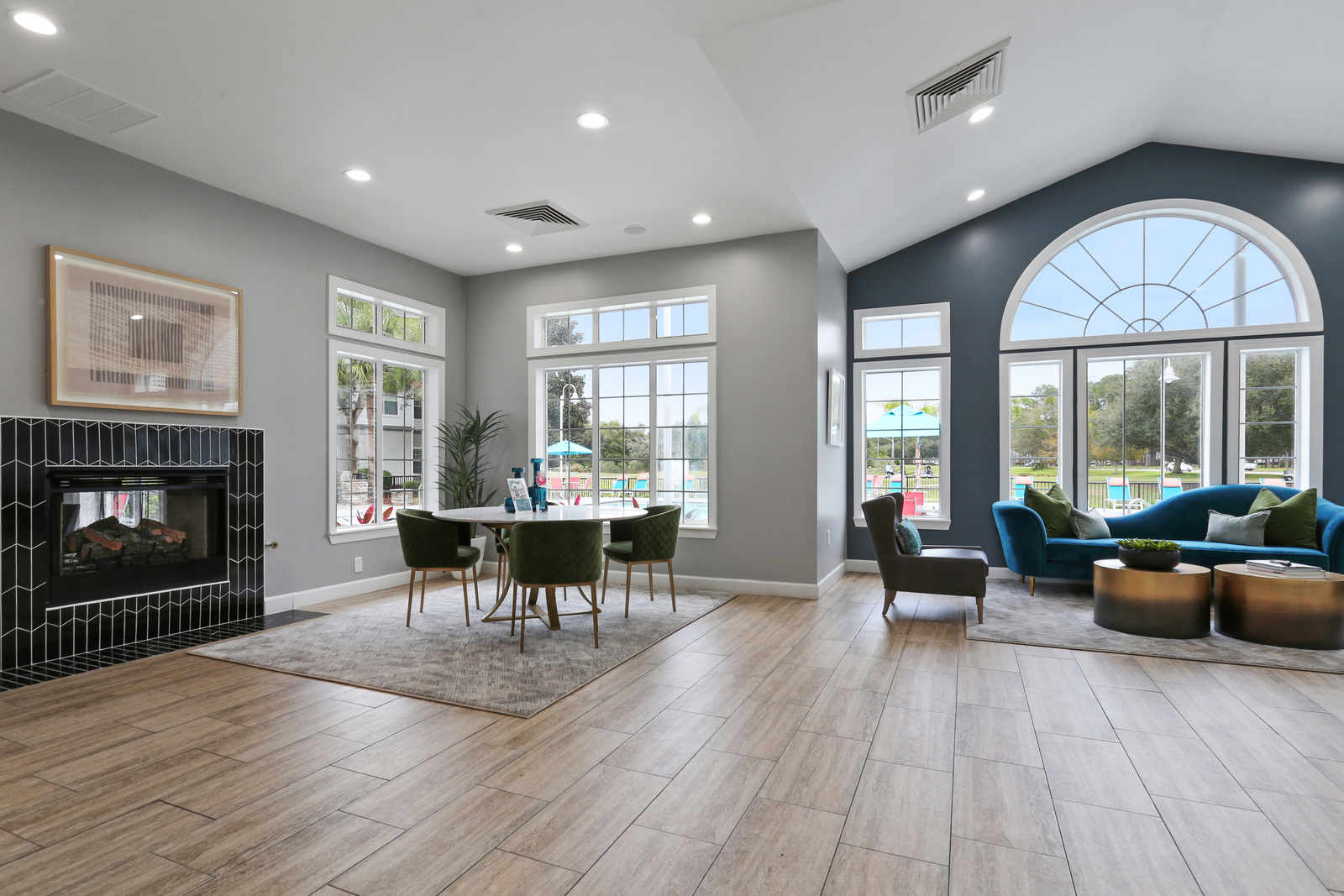 a living room filled with furniture and a large window