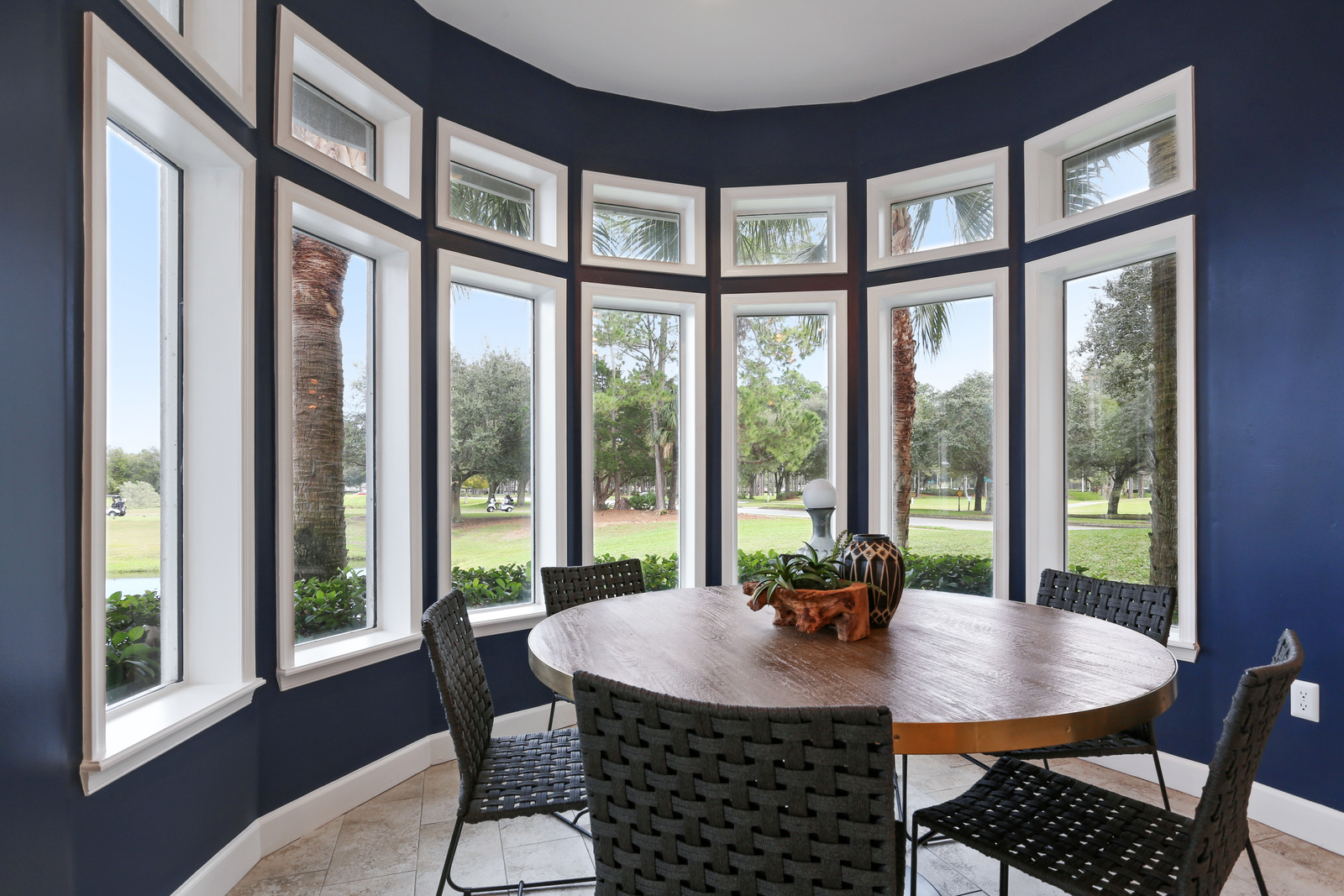 a living room filled with furniture and a large window