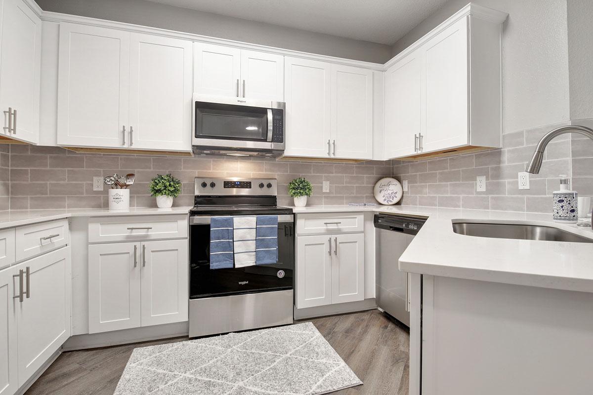 a kitchen with a sink and a microwave