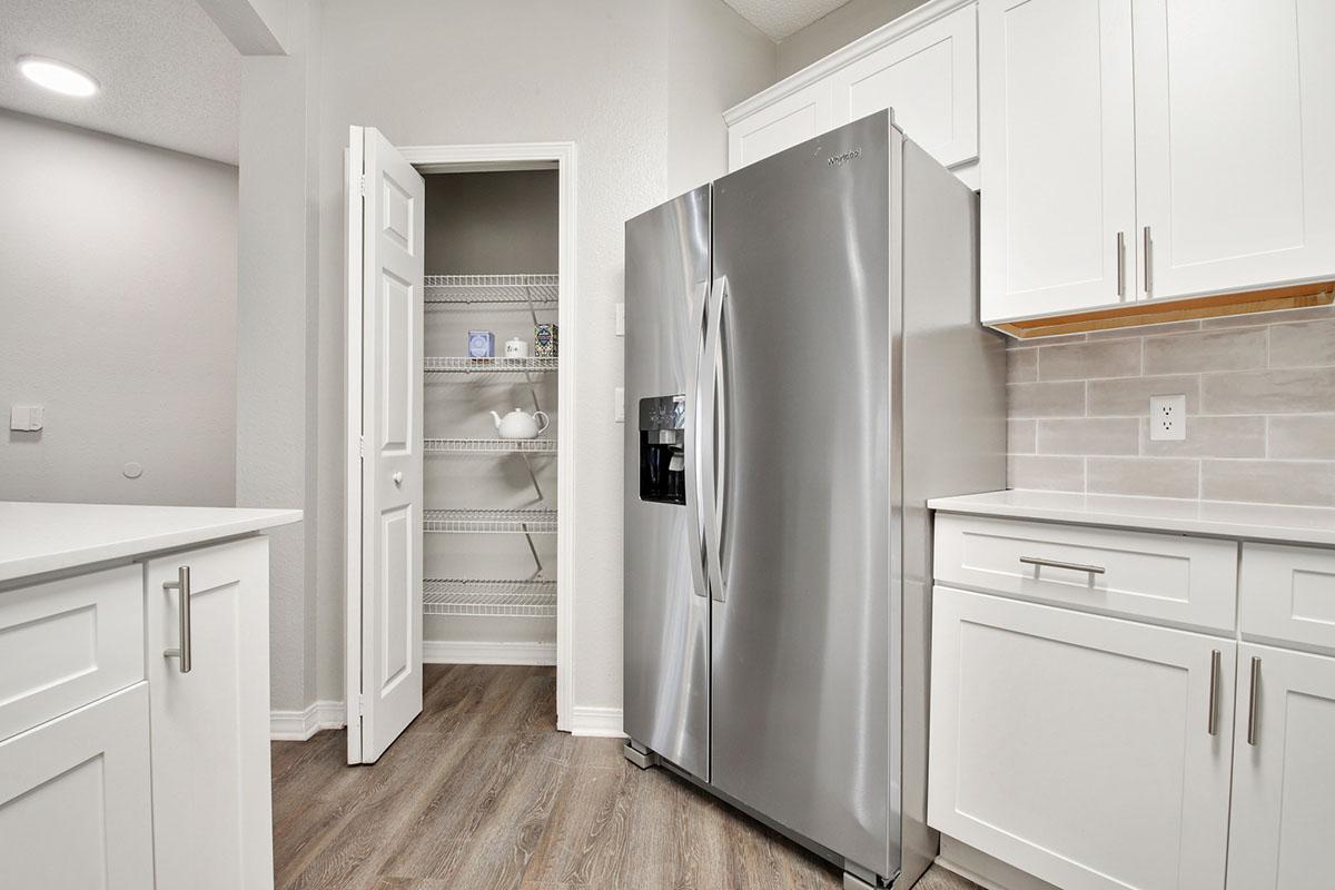 a white refrigerator freezer sitting inside of a kitchen