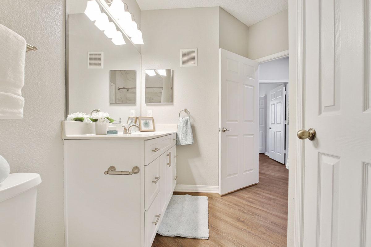 a white sink sitting next to a door