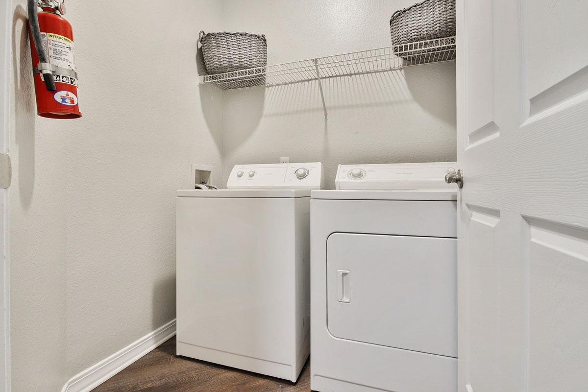 a white refrigerator freezer sitting inside of a kitchen