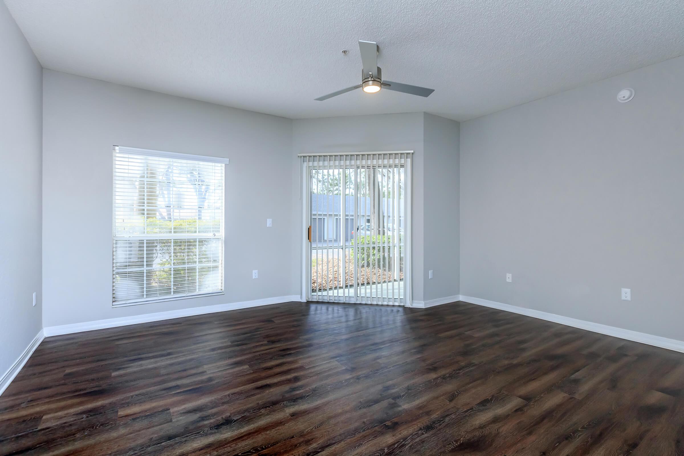 a room filled with furniture and a large window