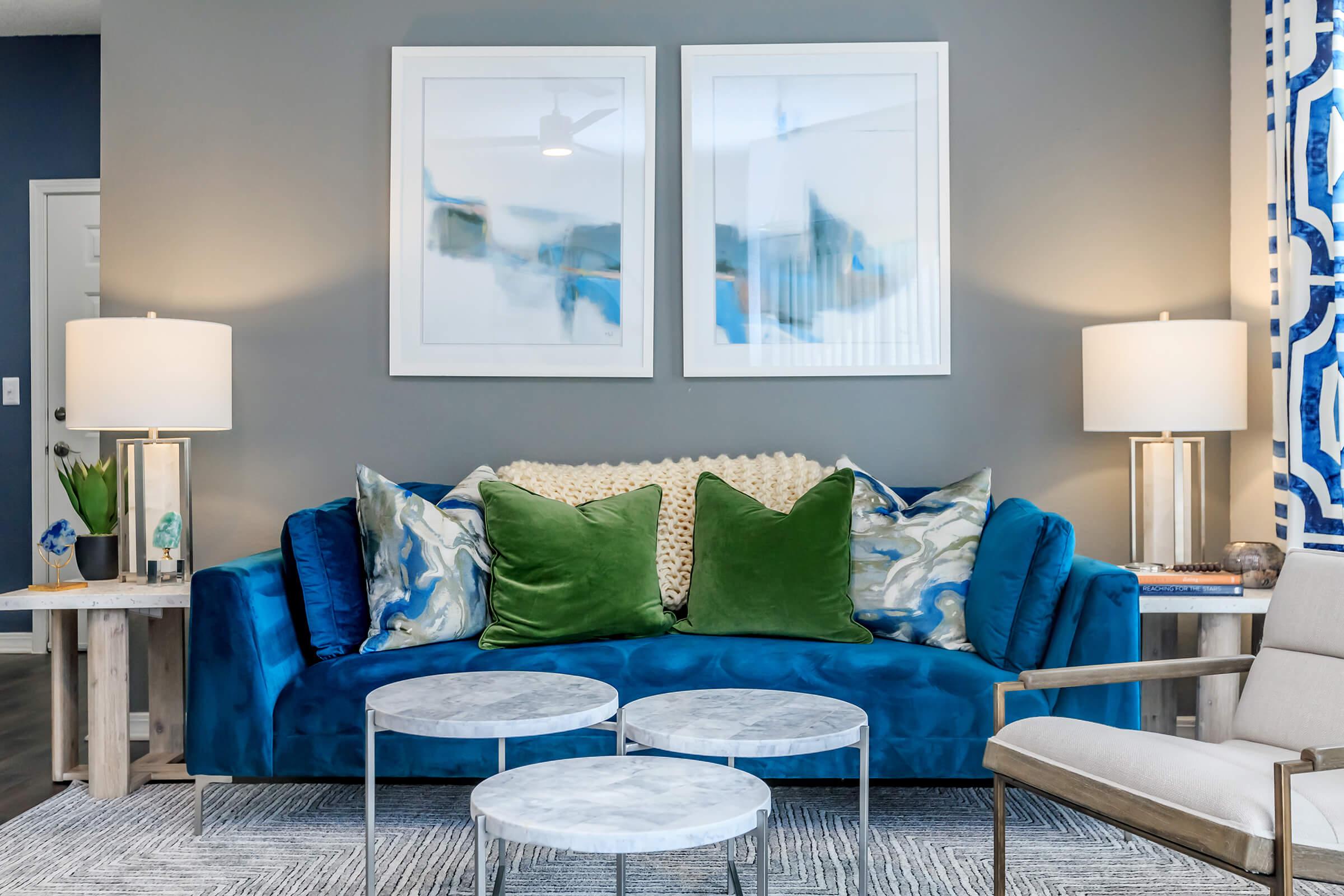 a living room with a blue chair