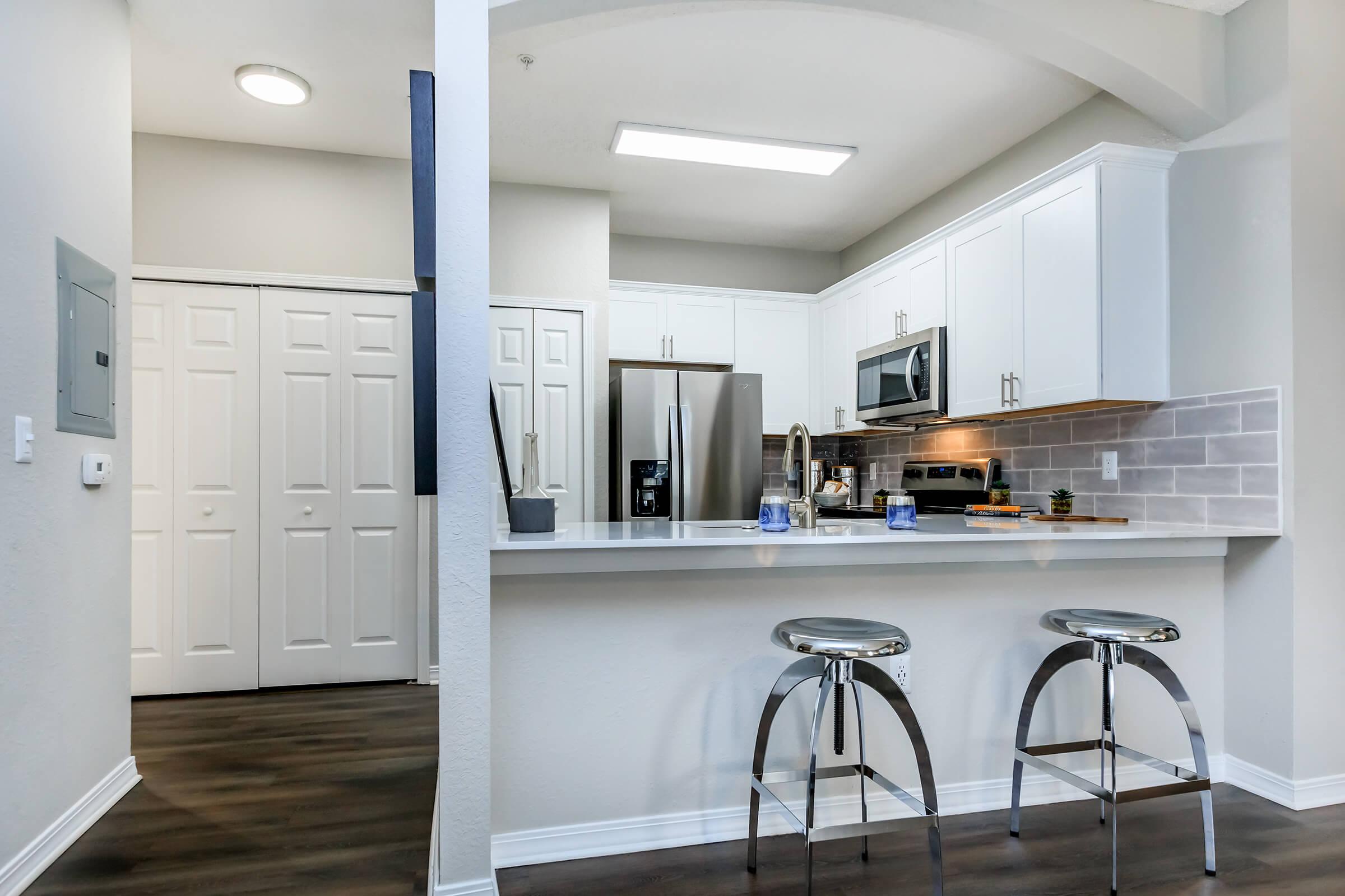 a kitchen with a sink and a microwave