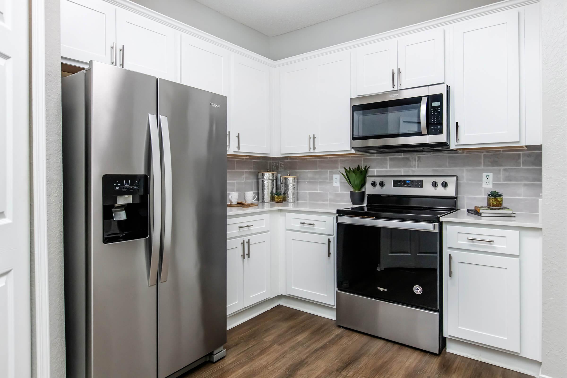 a stainless steel refrigerator in a kitchen