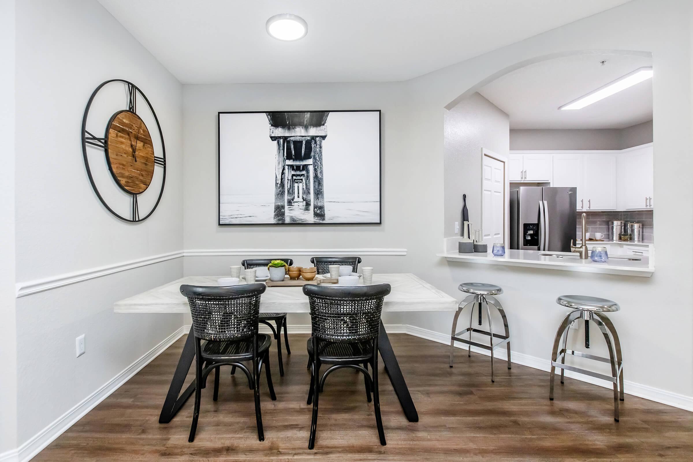 a kitchen with a dining room table