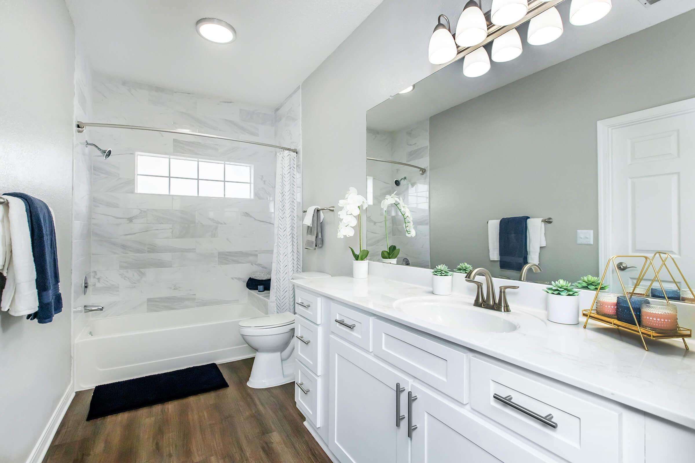 a kitchen with a sink and a mirror