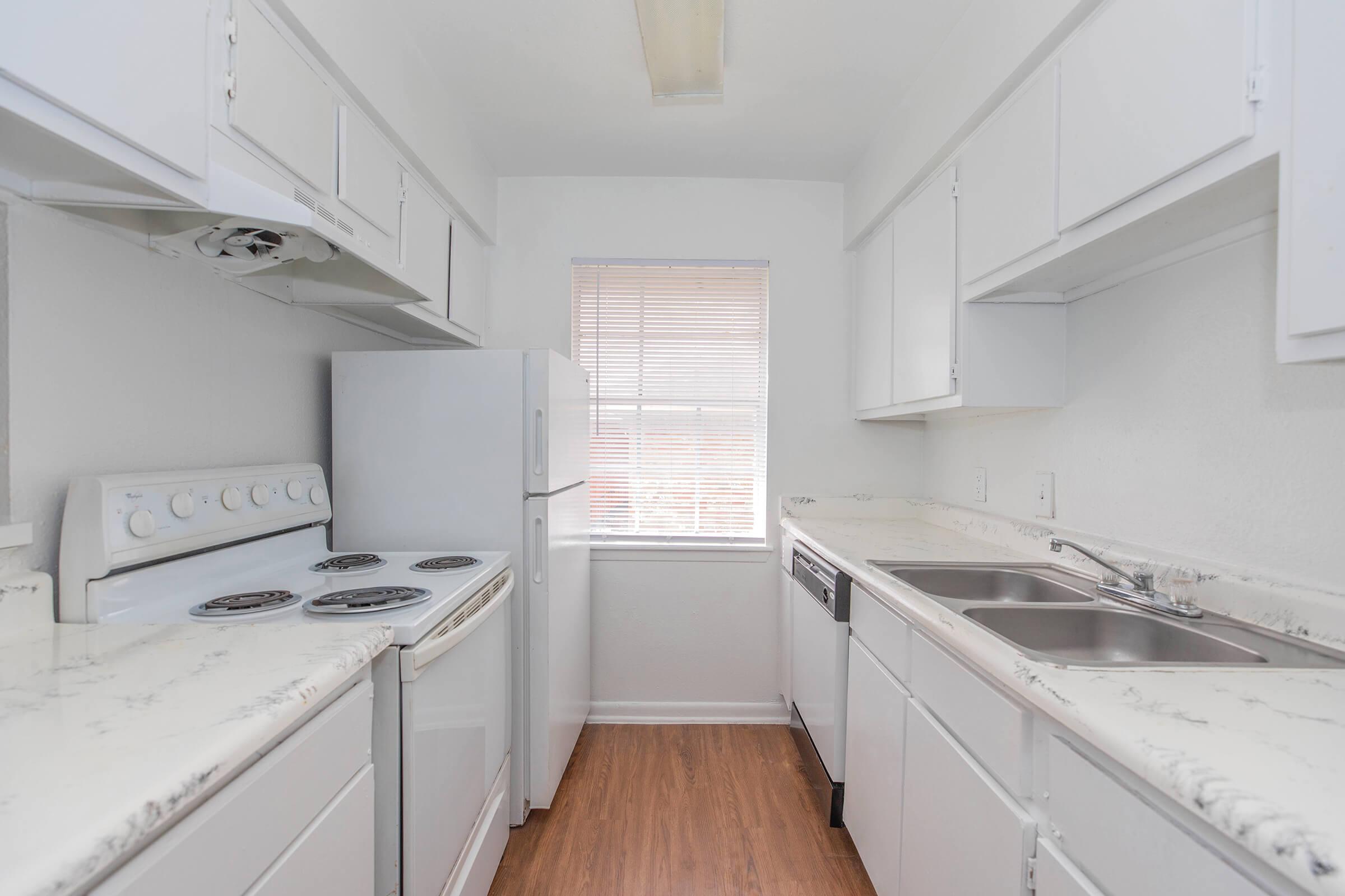 a kitchen with a stove and a sink